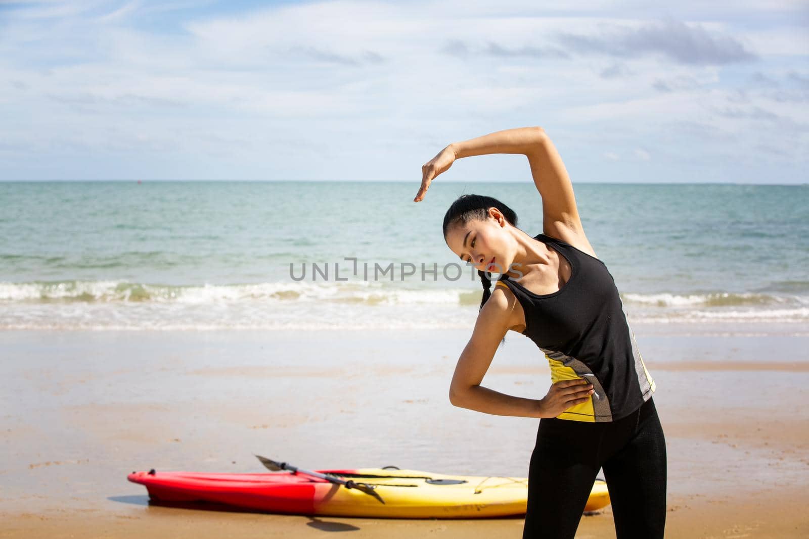 Woman on stand up paddle board. Having fun during warm summer beach vacation holiday, active woman by chuanchai