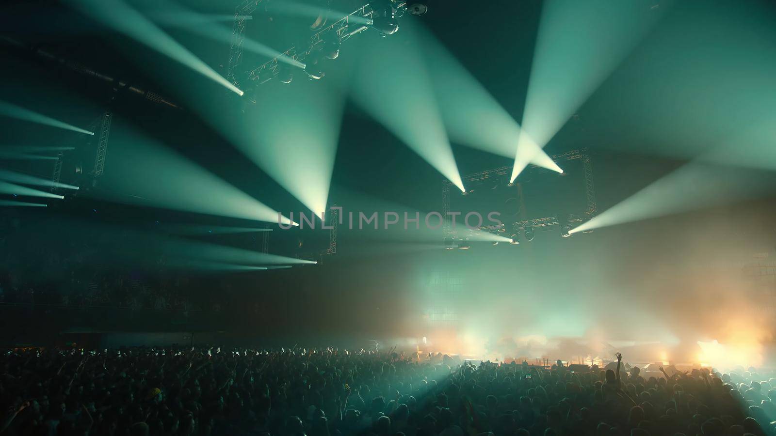 Concert Music festival and Celebrate. Party People Rock Concert. Crowd Happy and Joyful and Applauding or Clapping. Celebration party festival happiness. Blurry night club. Concert Show with DJ Music festival EDM on Stage by chuanchai