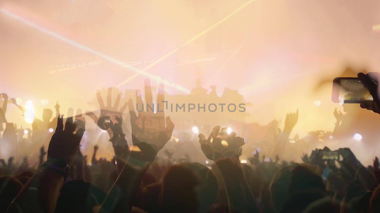 Concert Music festival and Celebrate. Party People Rock Concert. Crowd Happy and Joyful and Applauding or Clapping. Celebration party festival happiness. Blurry night club. Concert Show with DJ Music festival EDM on Stage by chuanchai