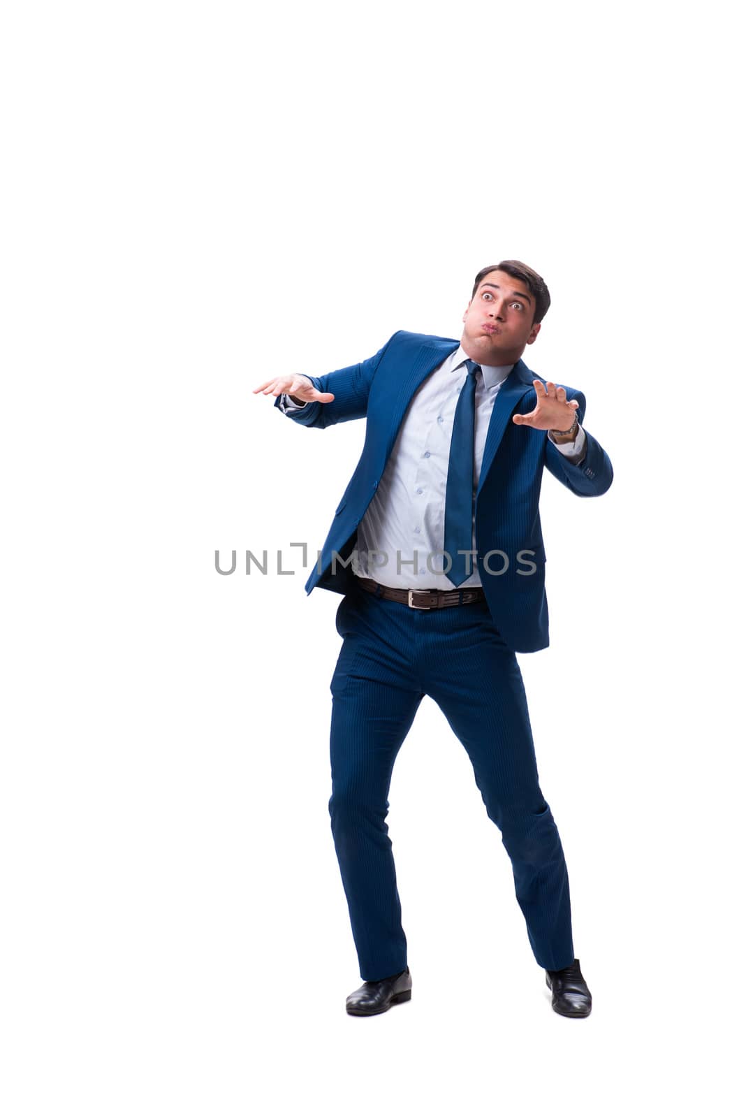 Businessman in funny pose isolated on white