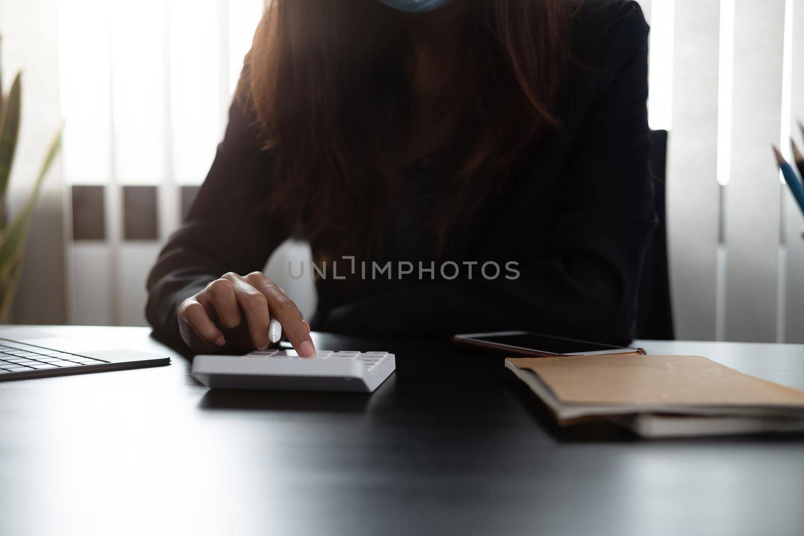 Tax deduction planning concept. Close up hand of businesswoman or accountant calculating business balance prepare tax reduction.