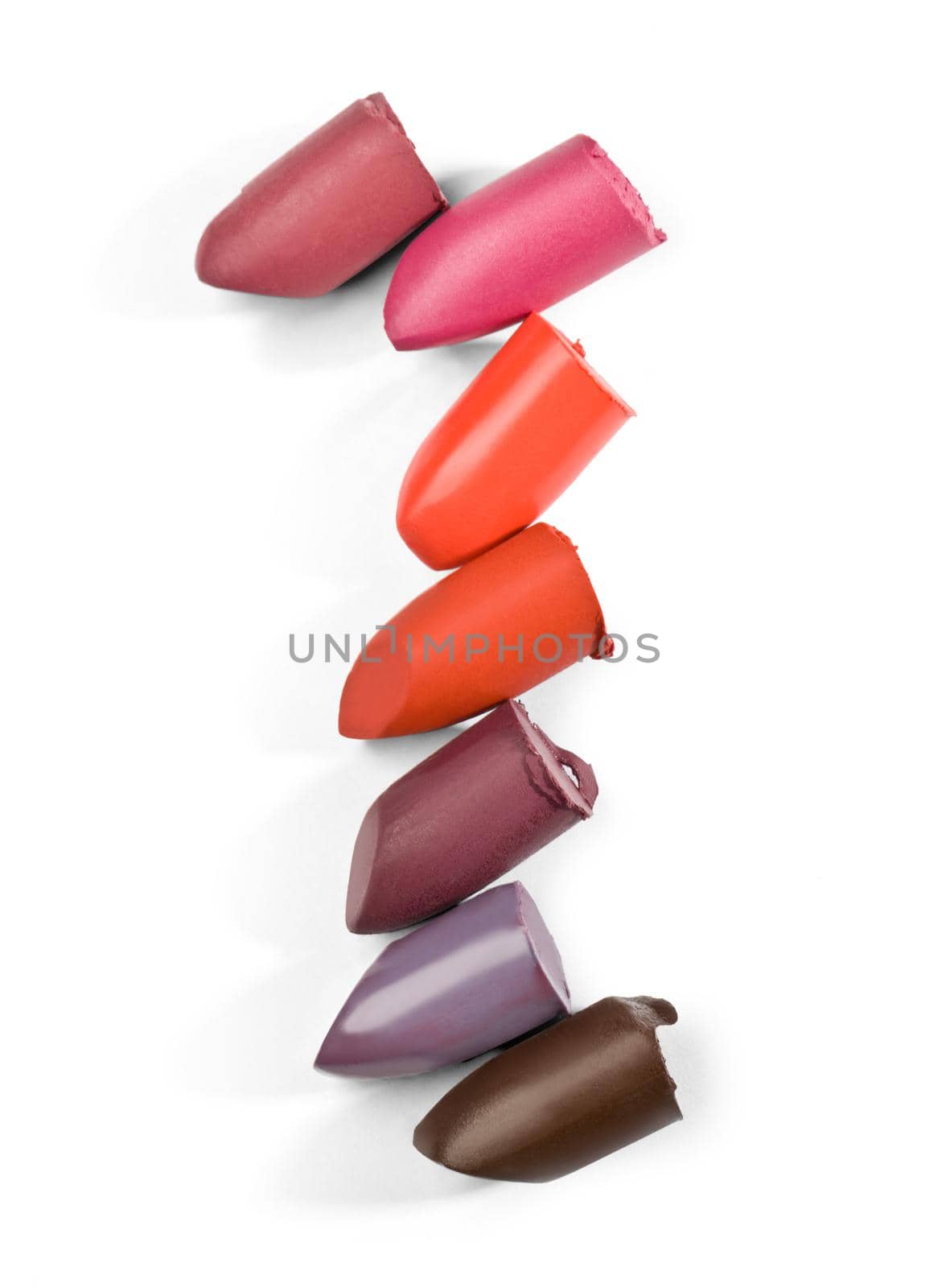 close up of a lipstick stack on white background