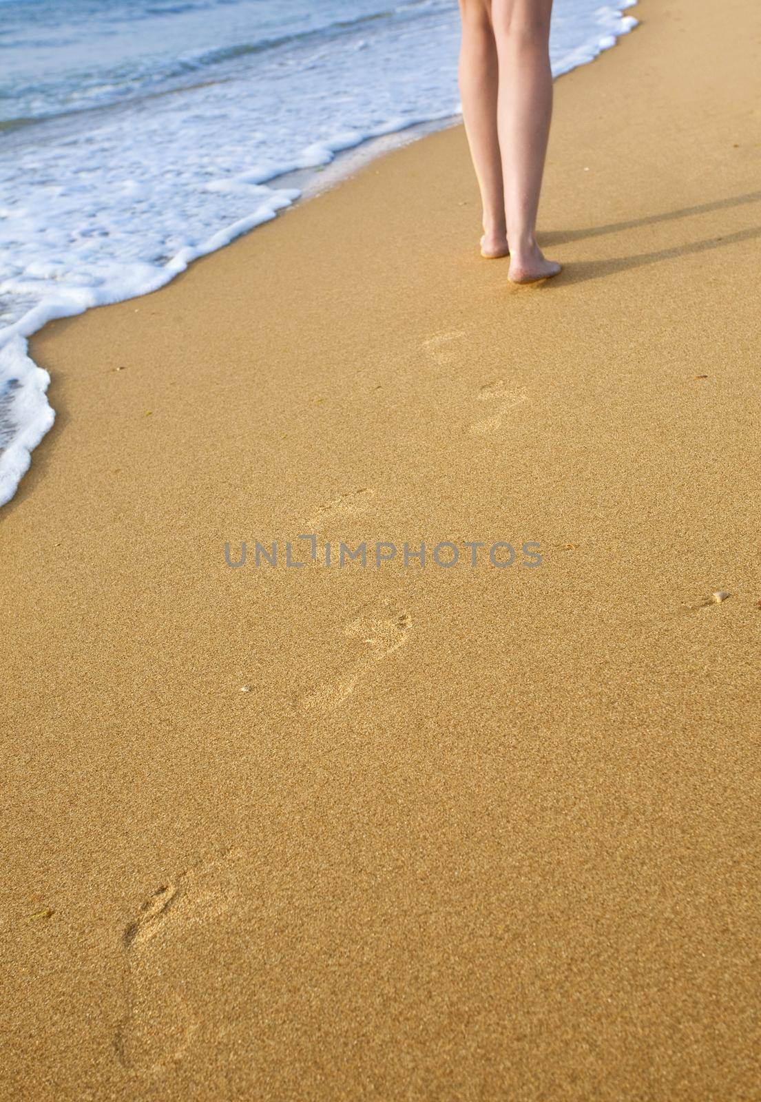 someone walking on the beach in the background