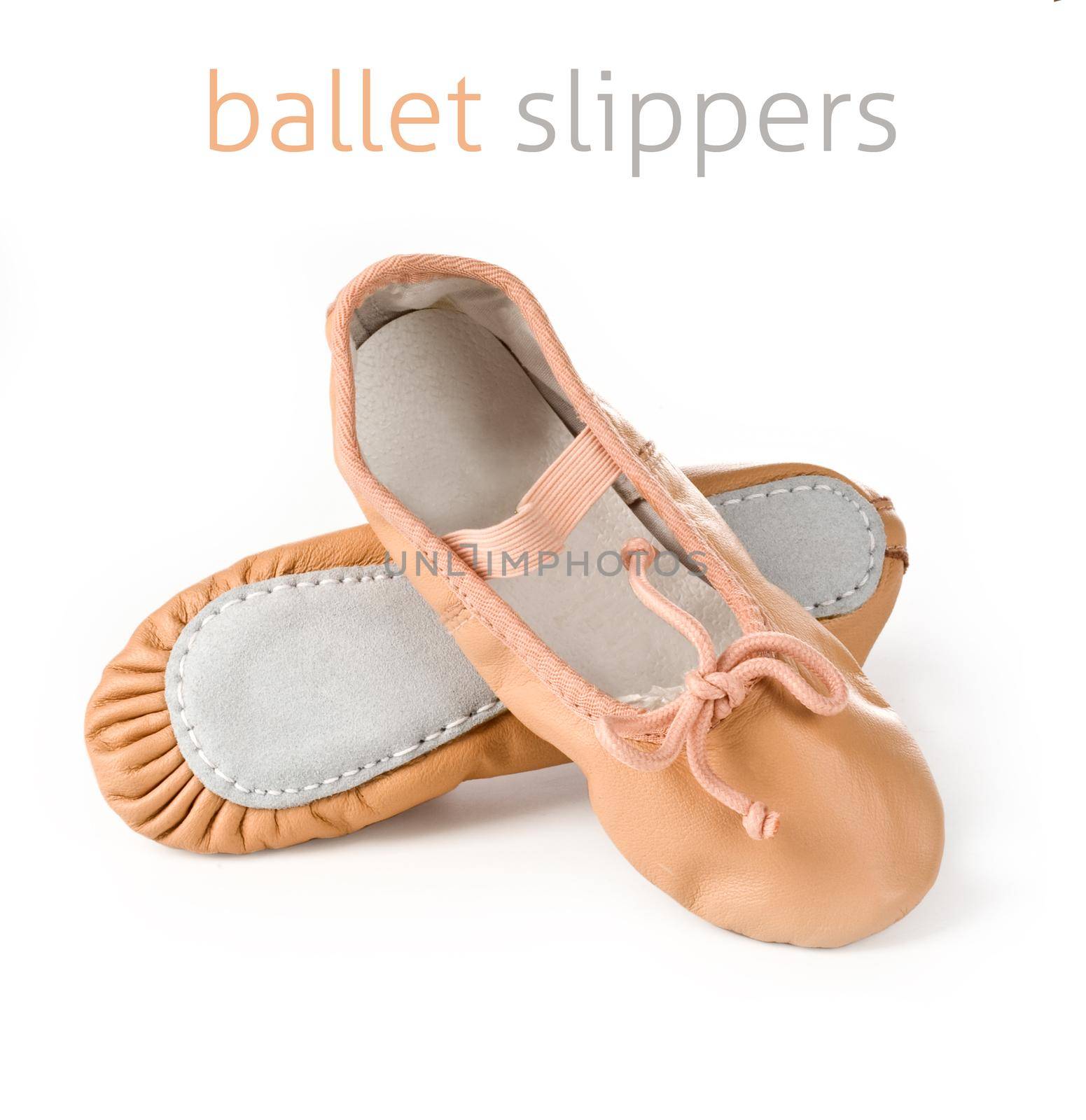 Small pink ballet slippers on a white background