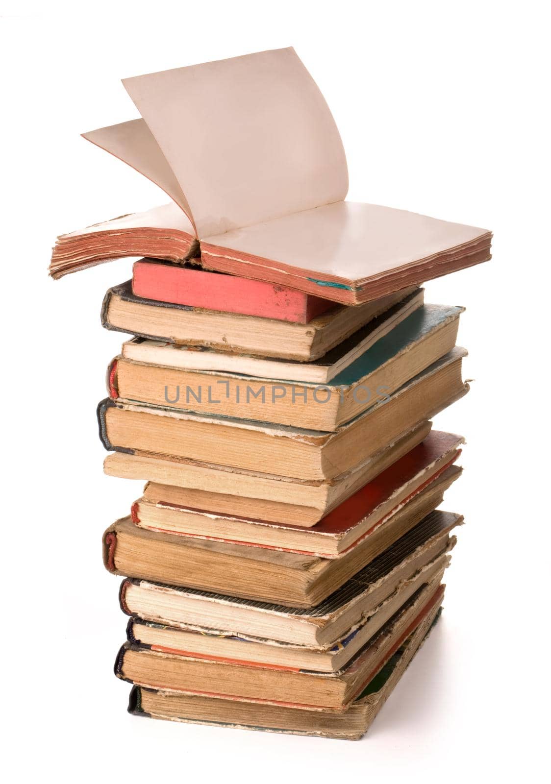 a stack of old books on white background