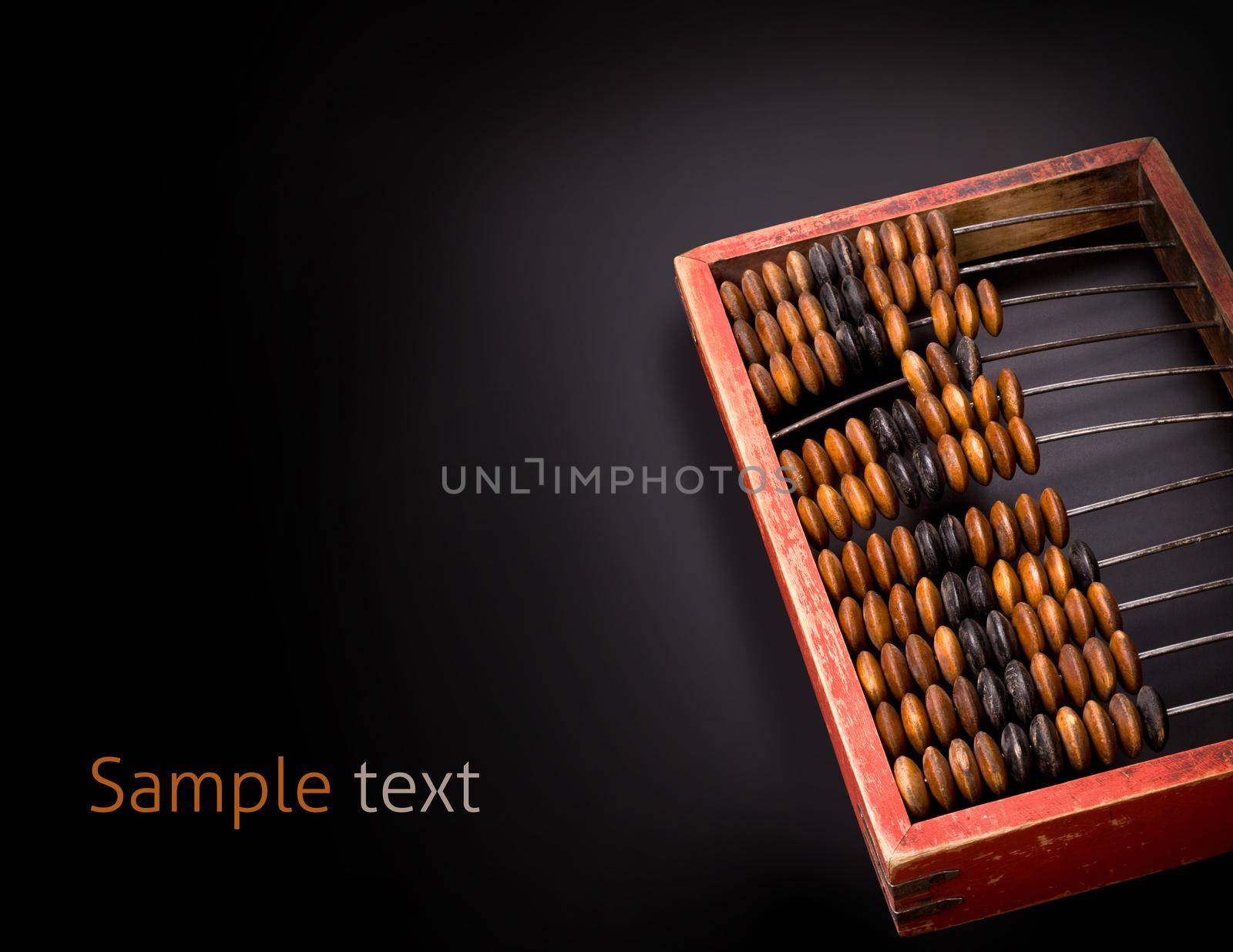 old wooden abacus on a dark background with place for text