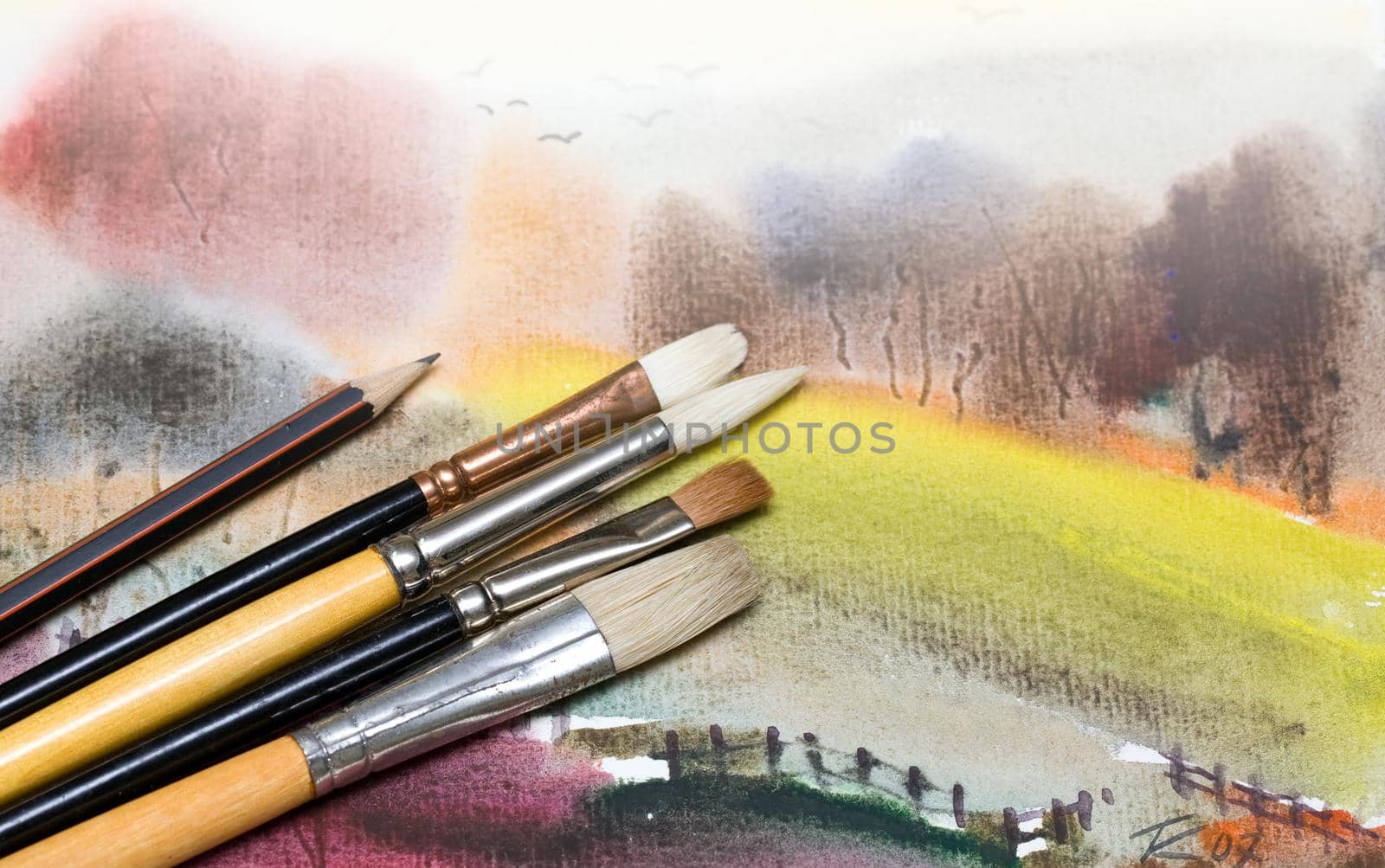 Paintbrush on painted background. by kornienko