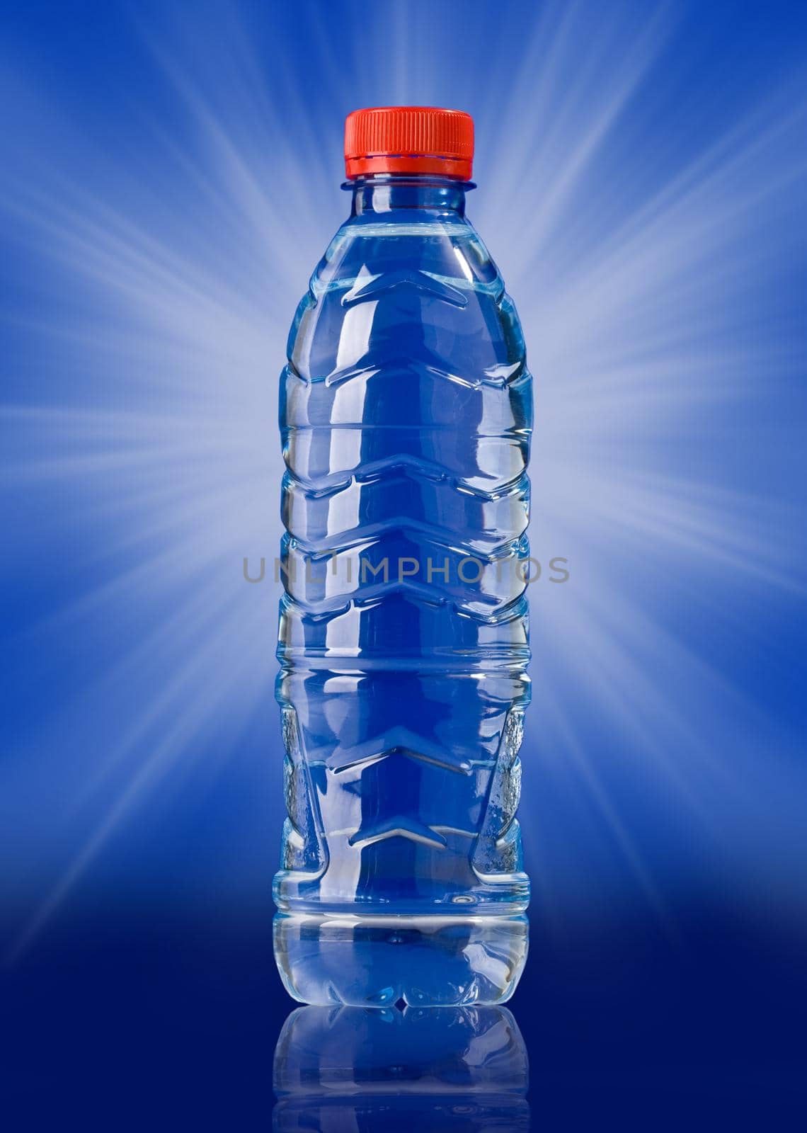 Plastic water bottle over blue background