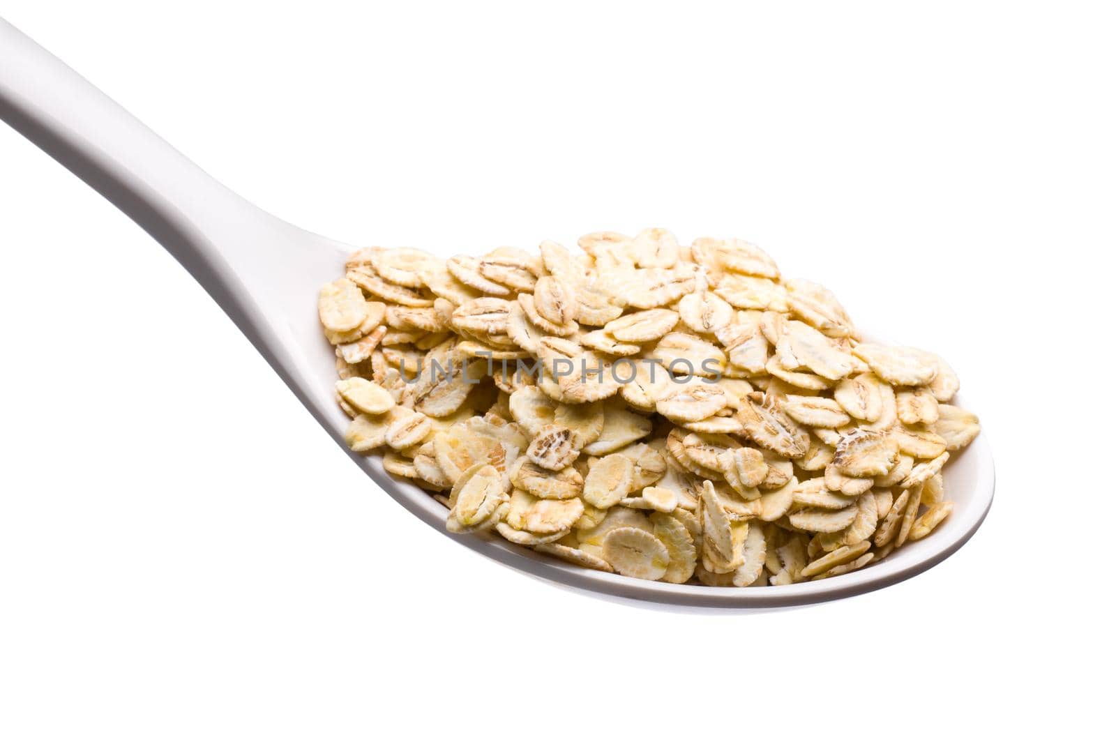 Fresh Whole Grain Oats in a White Spoon Isolated on White with a Clipping Path.