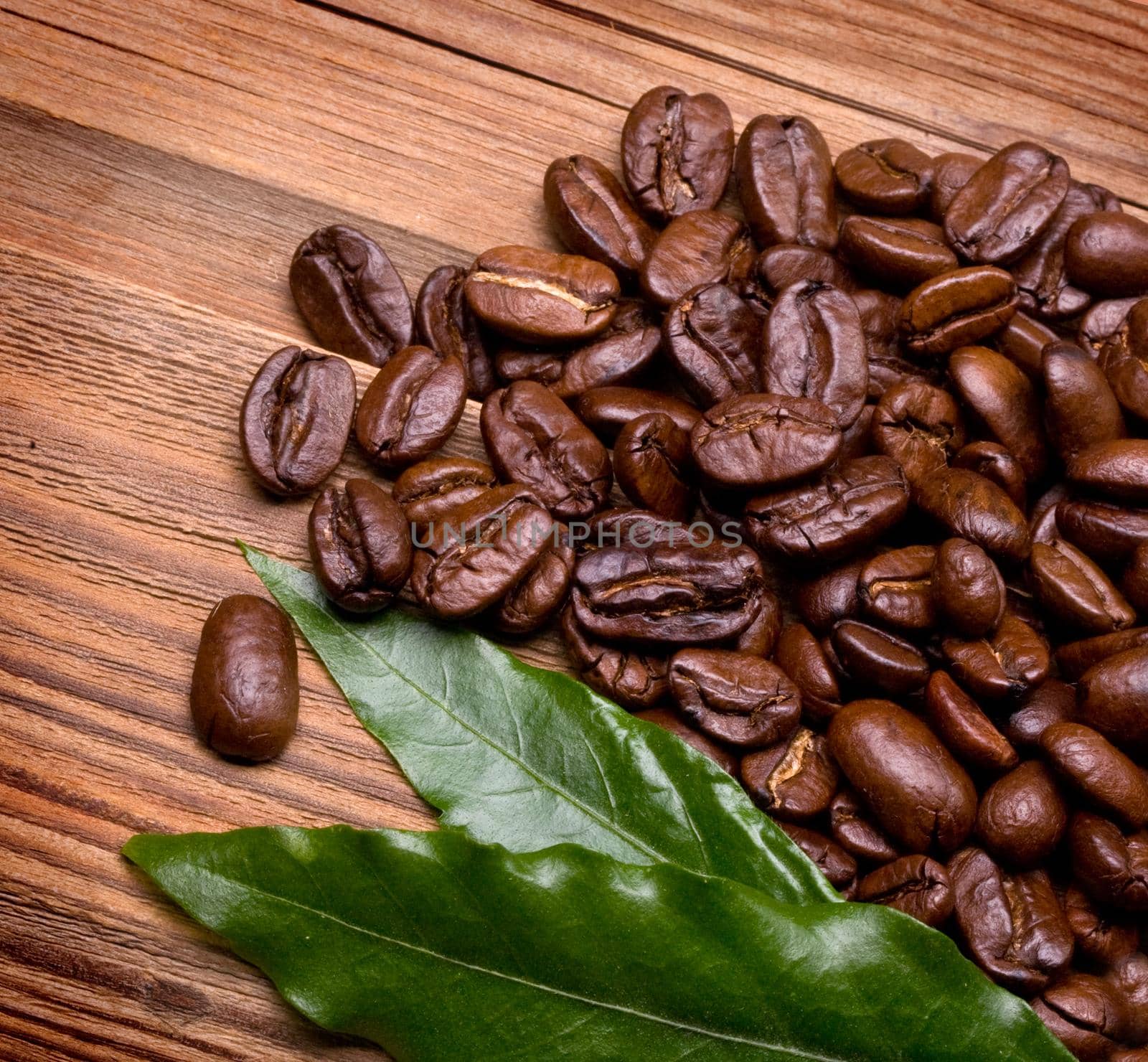 Coffee Beans over Wood Background
