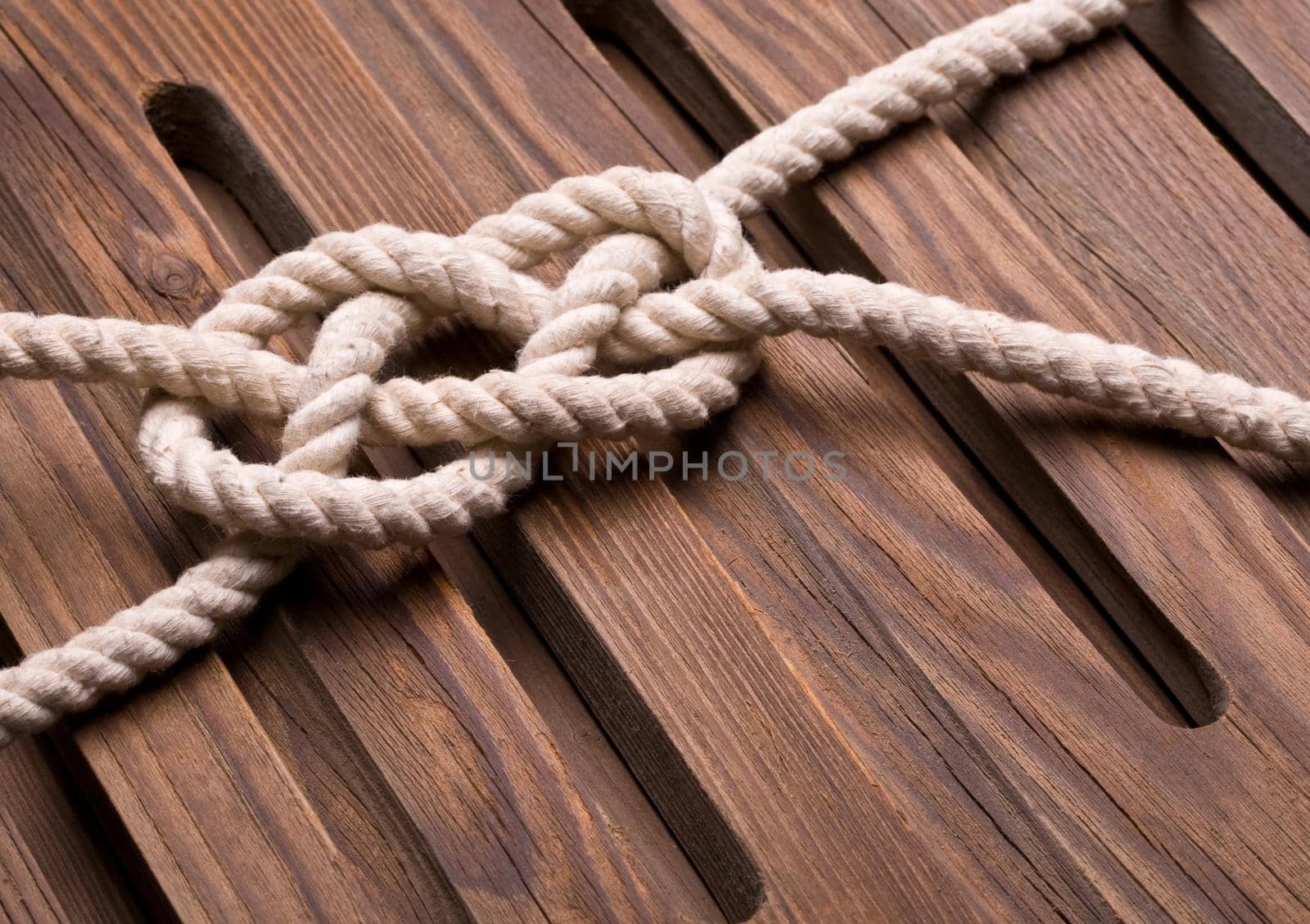 Marine knot on a wooden background