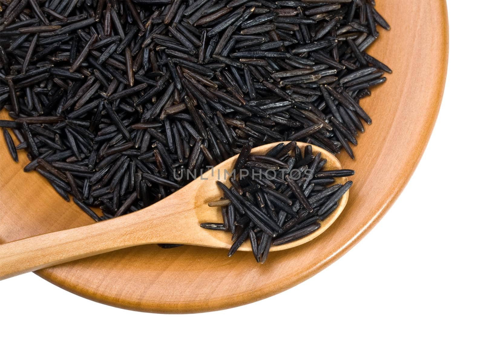 wooden plate with grains of black  rice on a white background with clipping paths