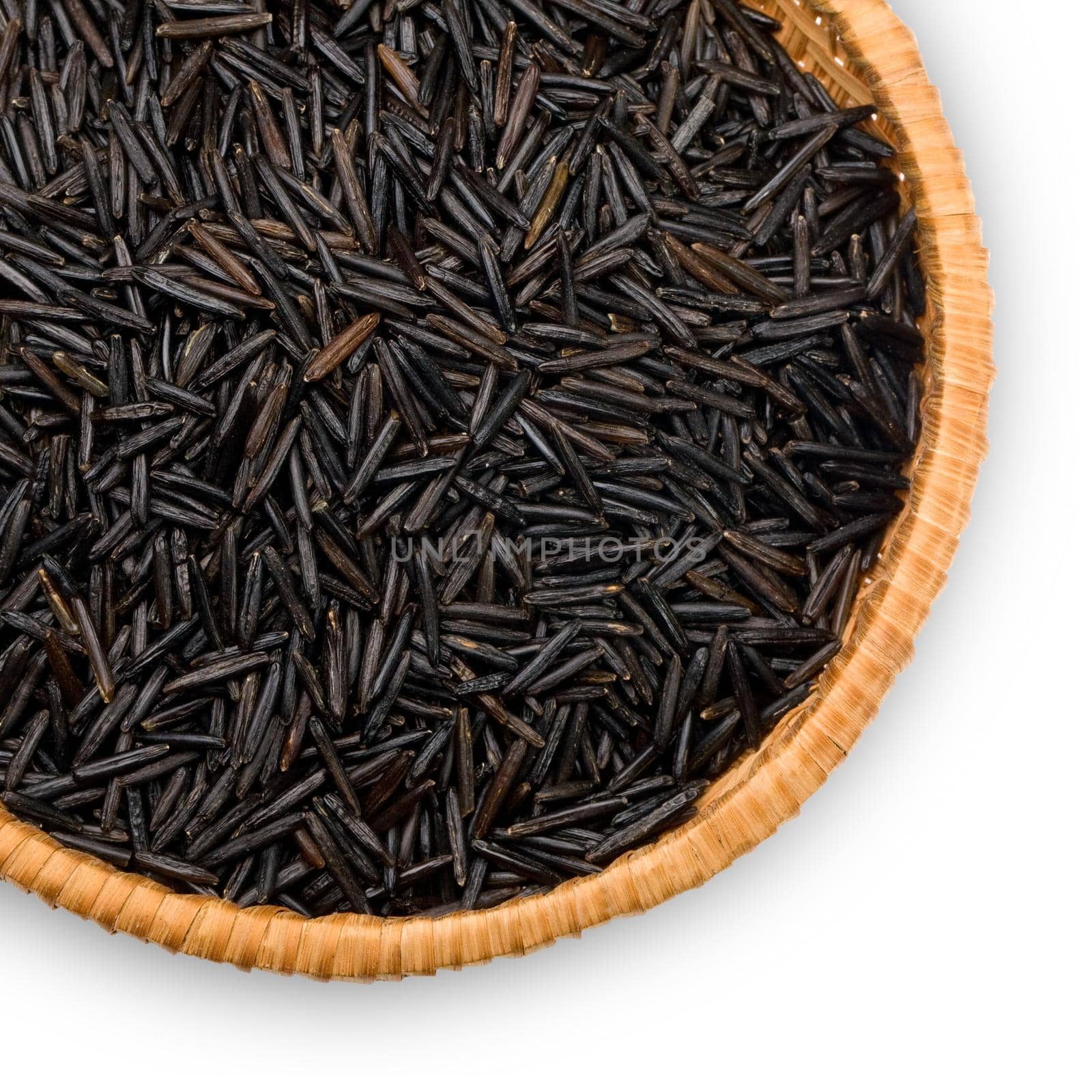 straw plate with wild black rice on a white background