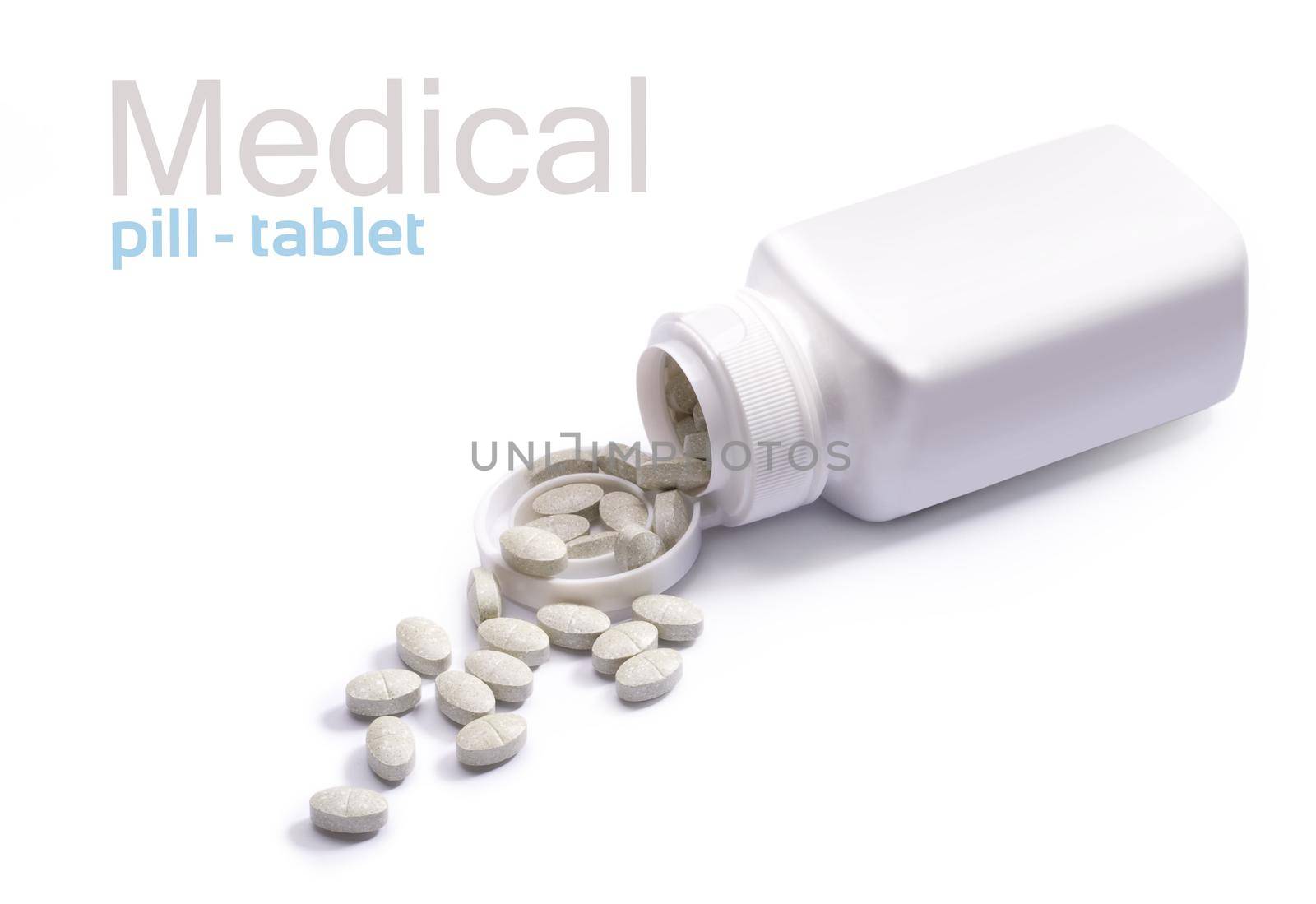 Pills and container on white background