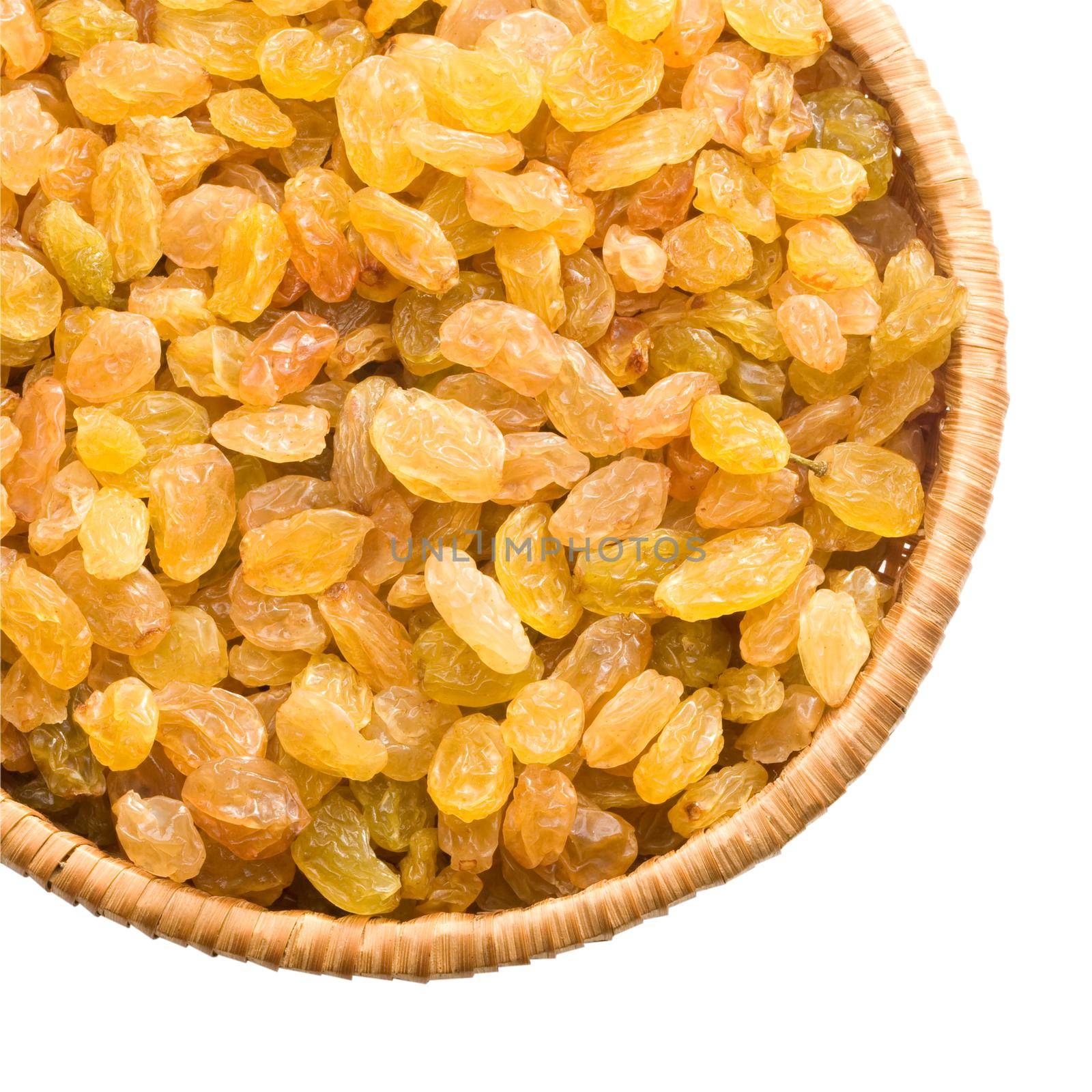 straw dish with raisins on a white background keeping paths