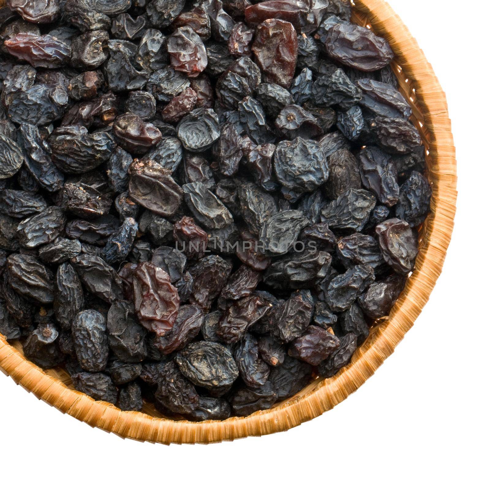 straw dish with raisins on a white background keeping paths