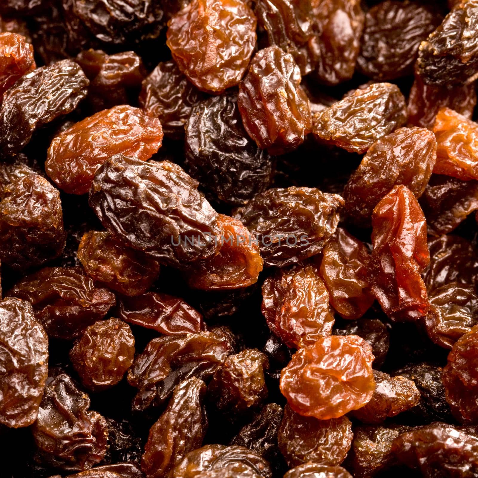 Brown raisins close up background