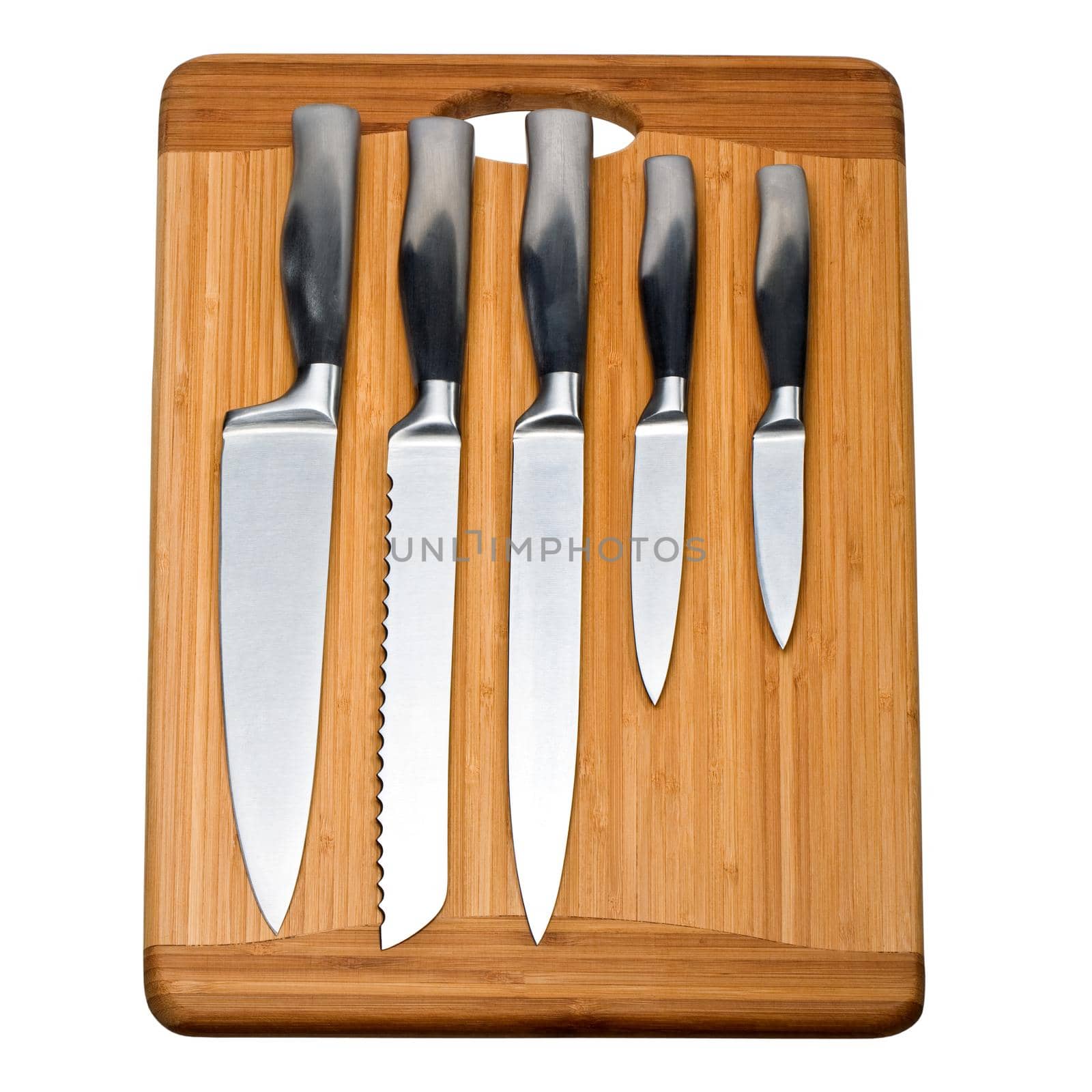 set of kitchen knives on a wooden cutting board
