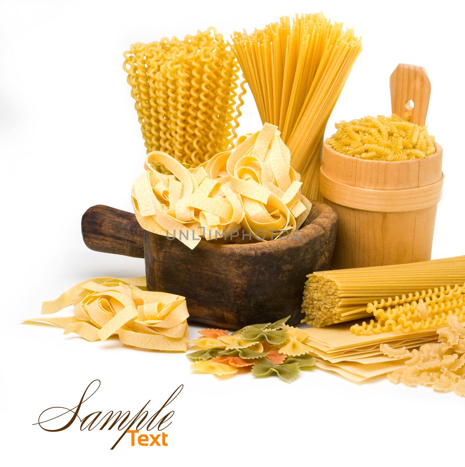 pasta and wooden plate isolated on white background