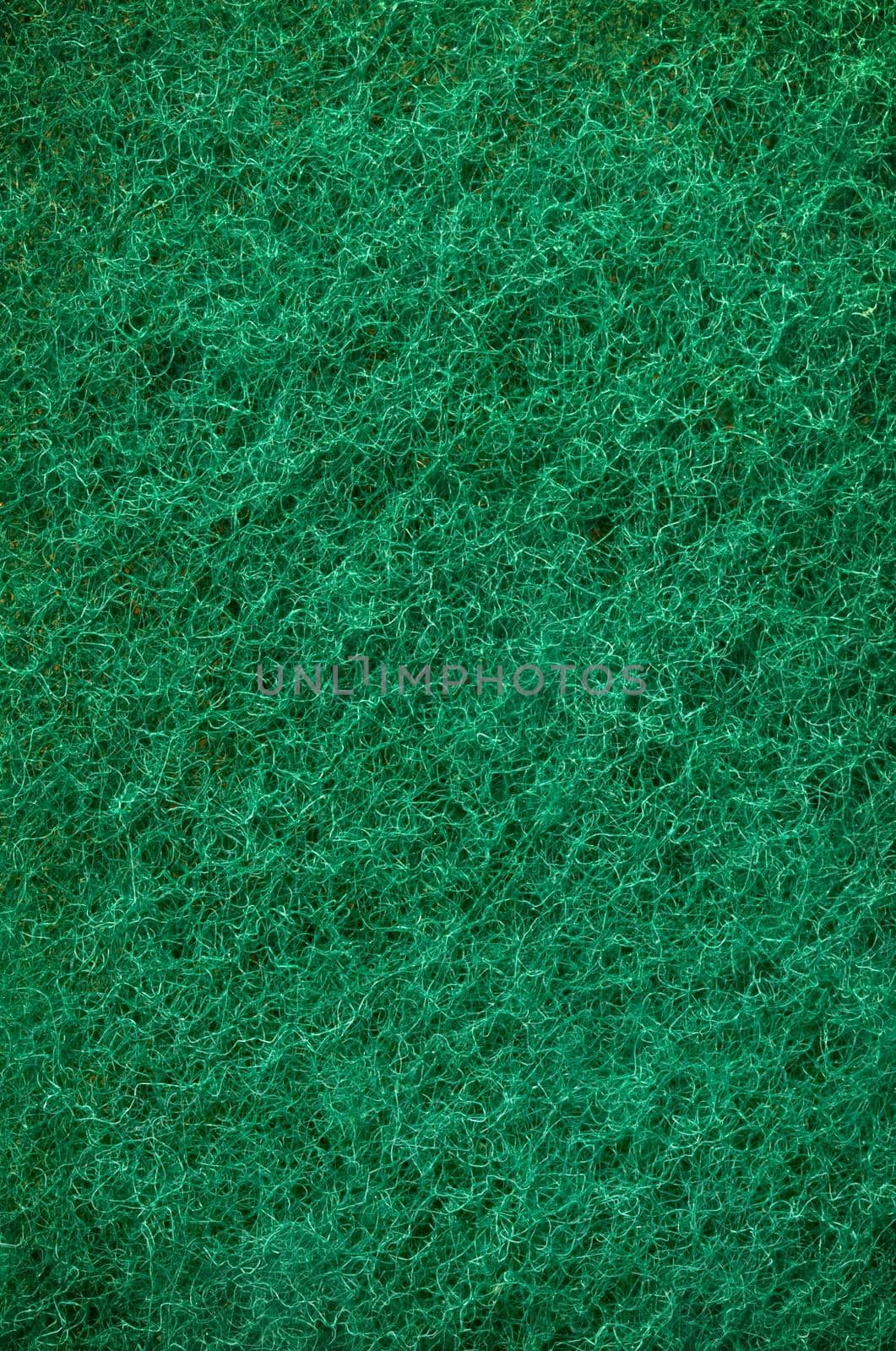 Green abrasive sponge texture background like grass