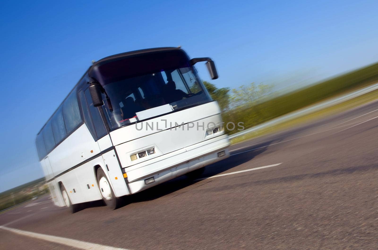 tourist bus traveling  on a highway