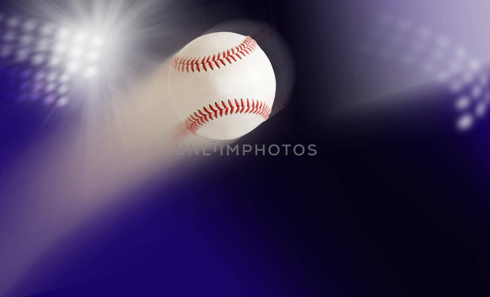 baseball in air against the background of the stadium lights