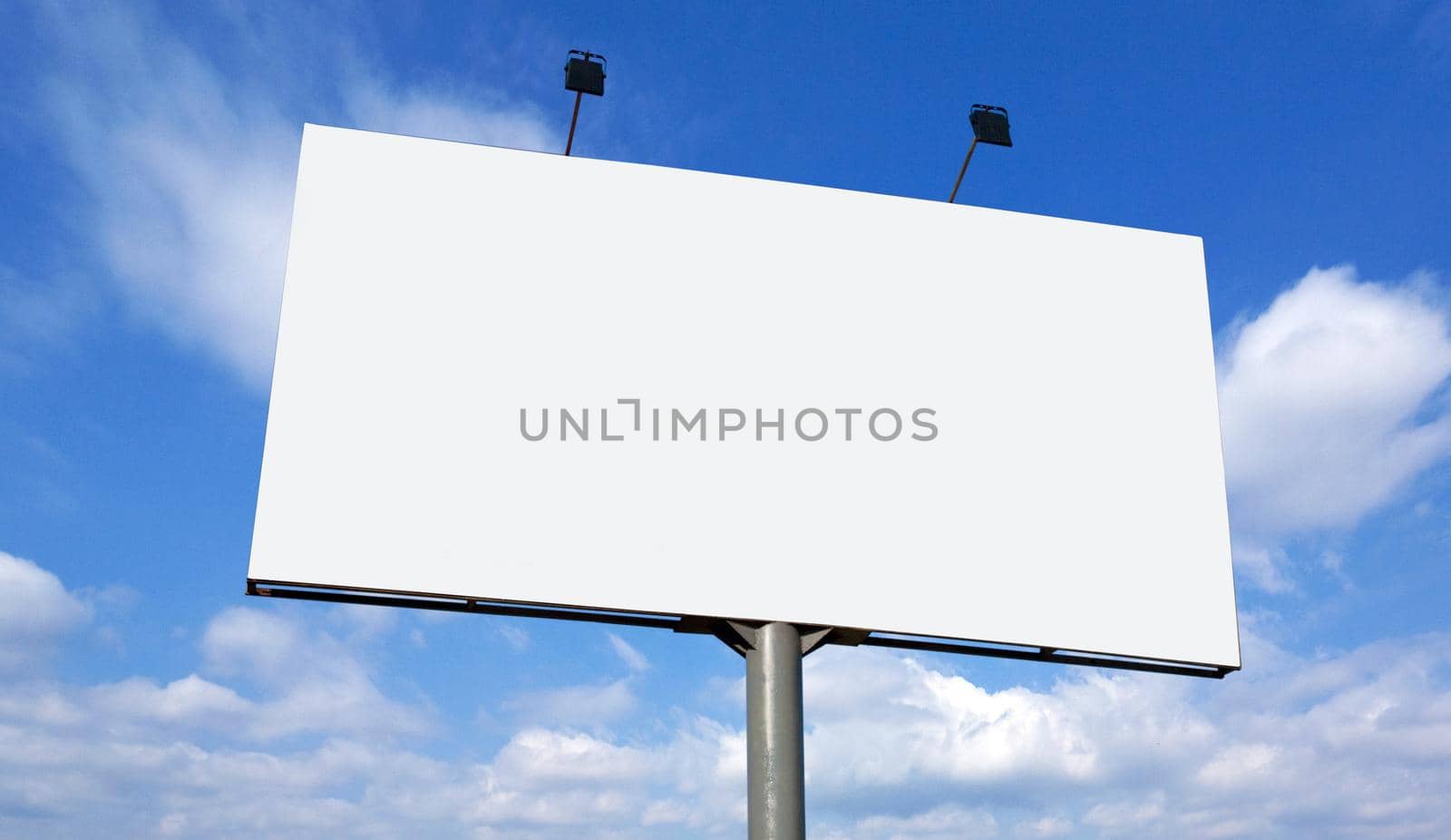 Blank billboard against blue sky, put your own text here