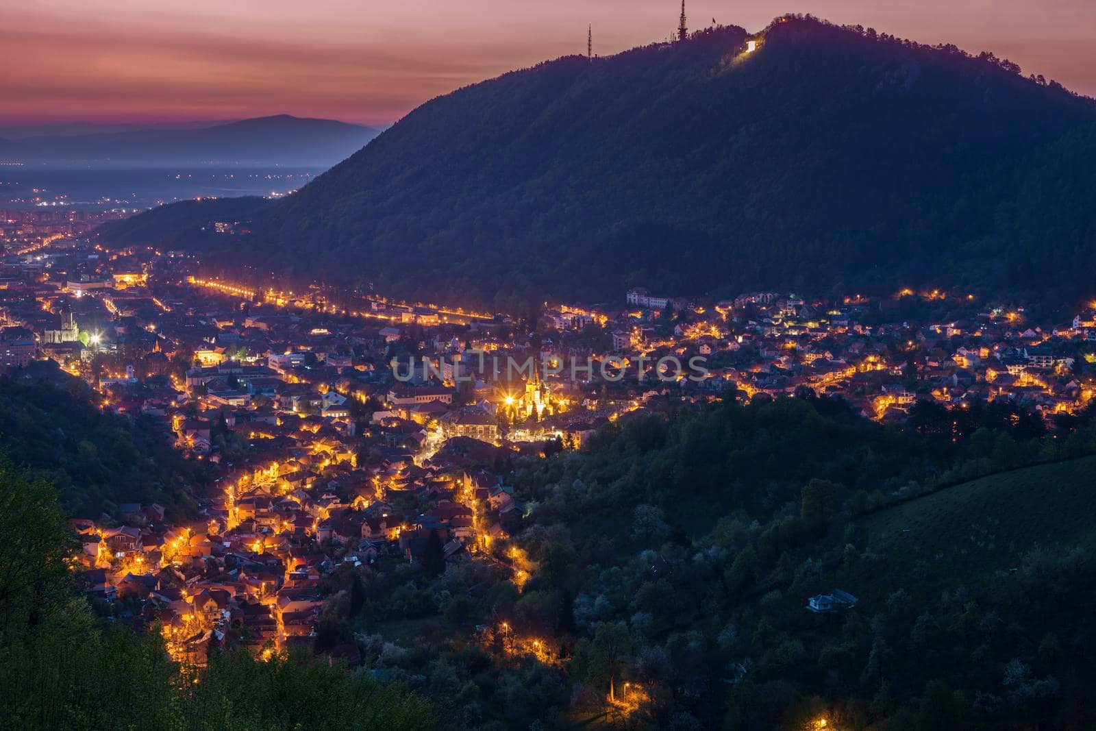 Aerial panorama of Brasov at dawn. Brasov, Brasov County, Romania.
