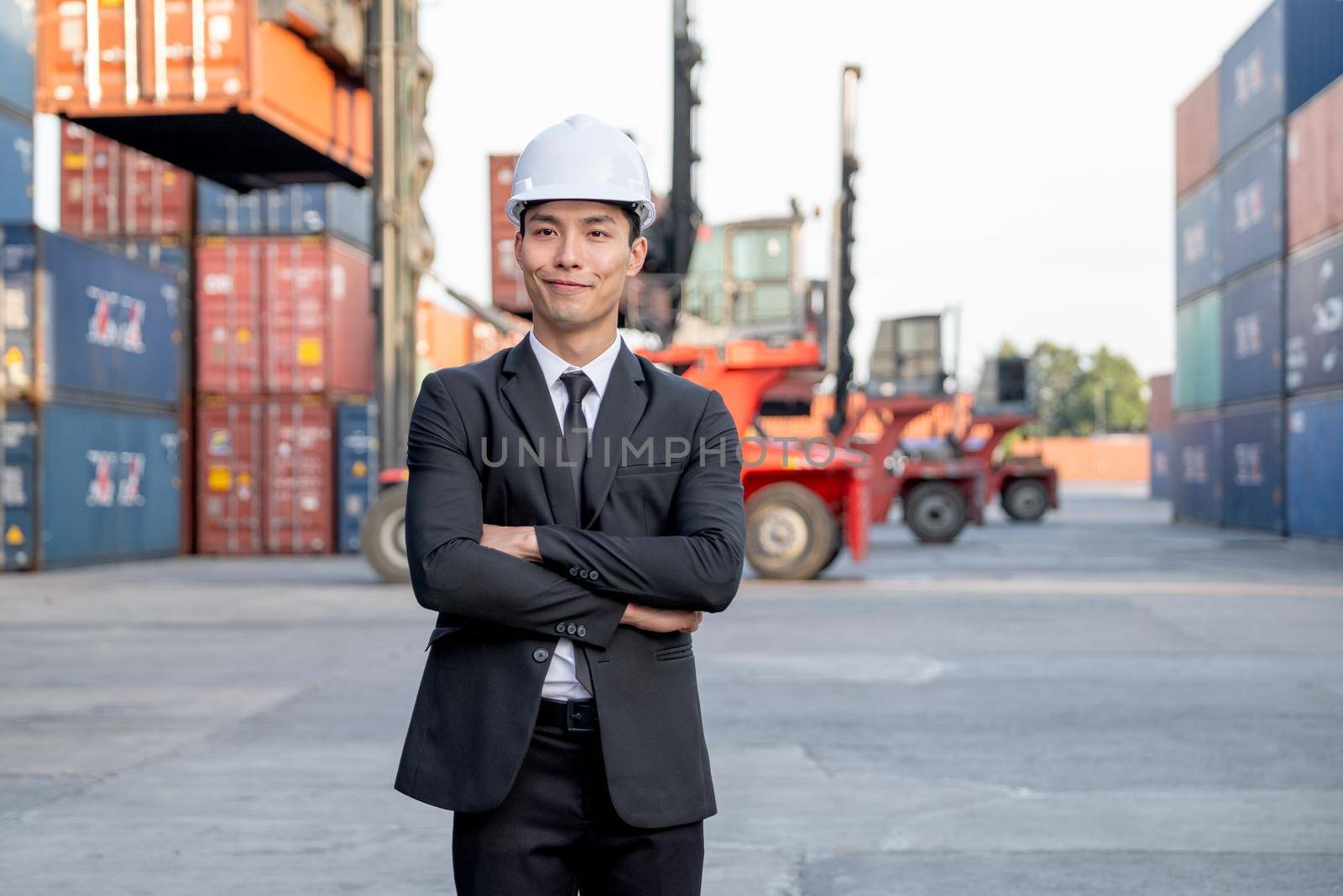 Portrait of engineer worker of factory technician with Chinese style man stand with confidence action and smile in workplace area. Concept of good support best successful for industrial business.