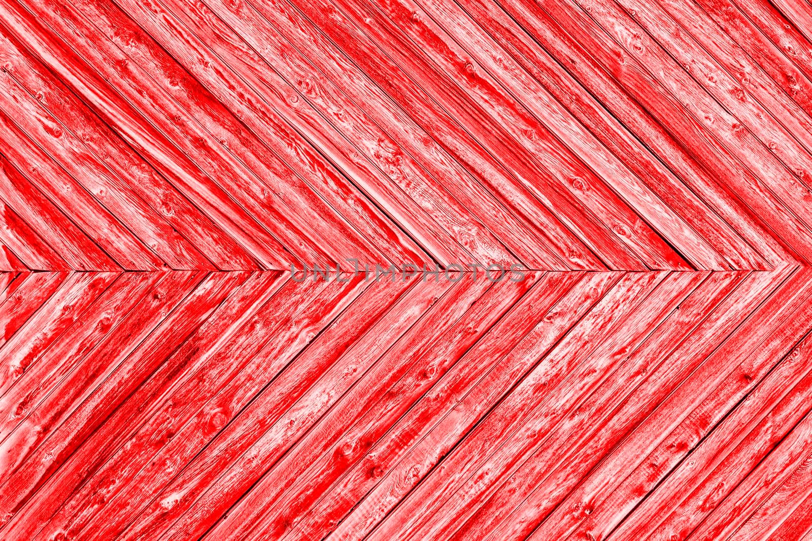 Red background is made of narrow wooden planks at an angle to each other. by Essffes