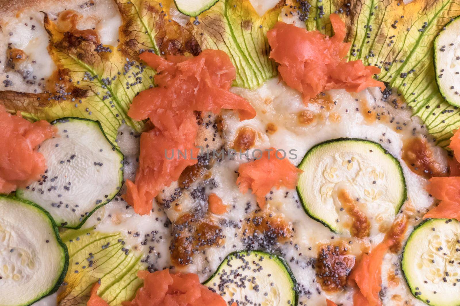 Delicious pizza with salmon and vegetables. italian pizza.