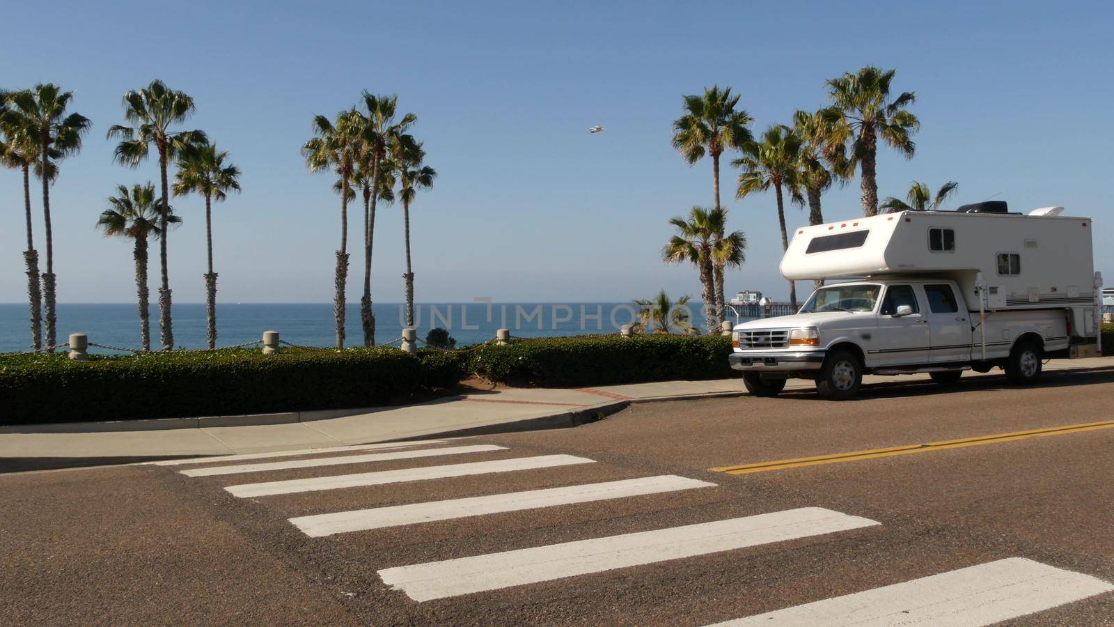 Motorhome trailer or caravan for road trip. Ocean beach, California USA. Camper van, RV motor home. by DogoraSun