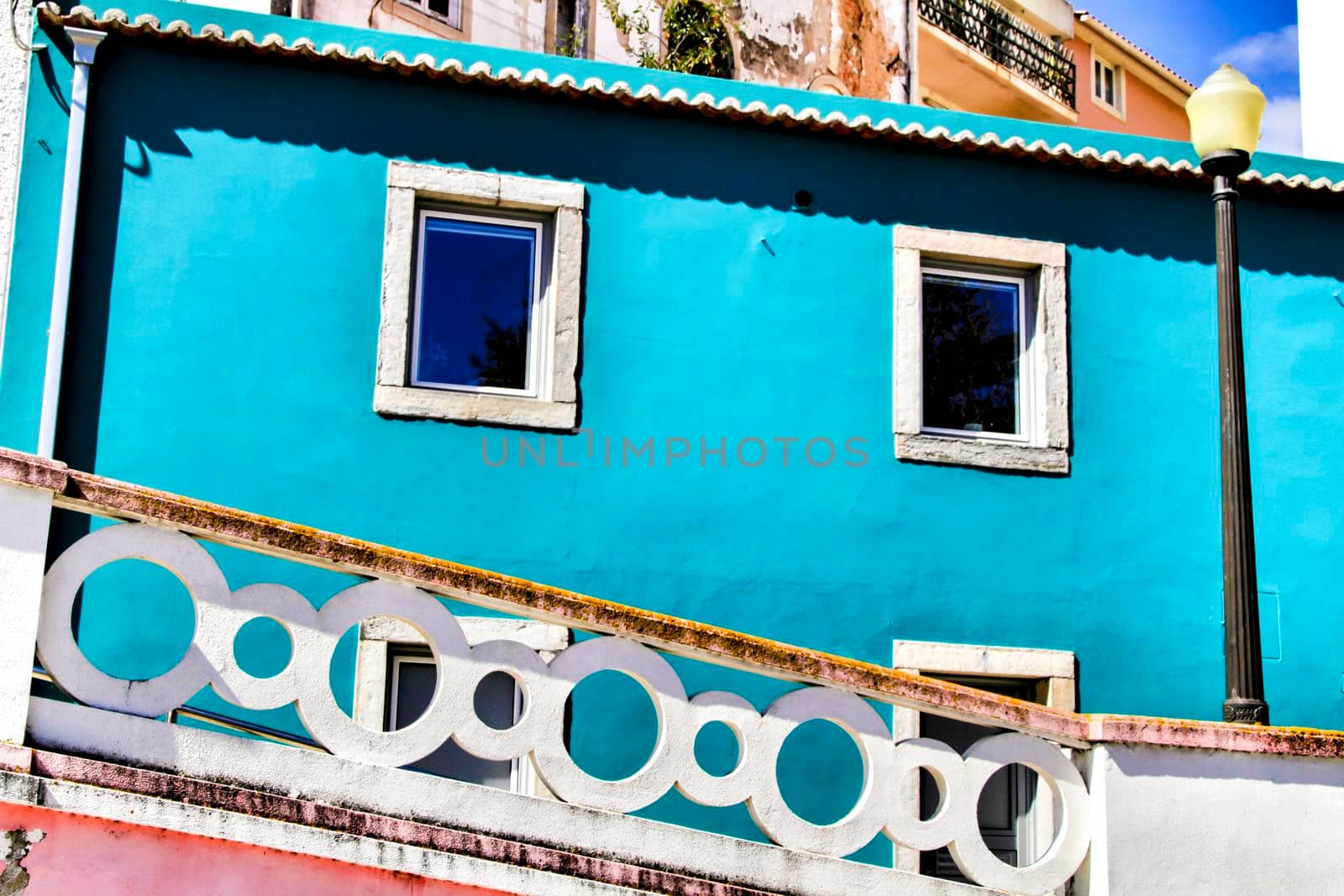 Narrow and colorful streets, majestic facades, windows and balconies of Lisbon, Portugal