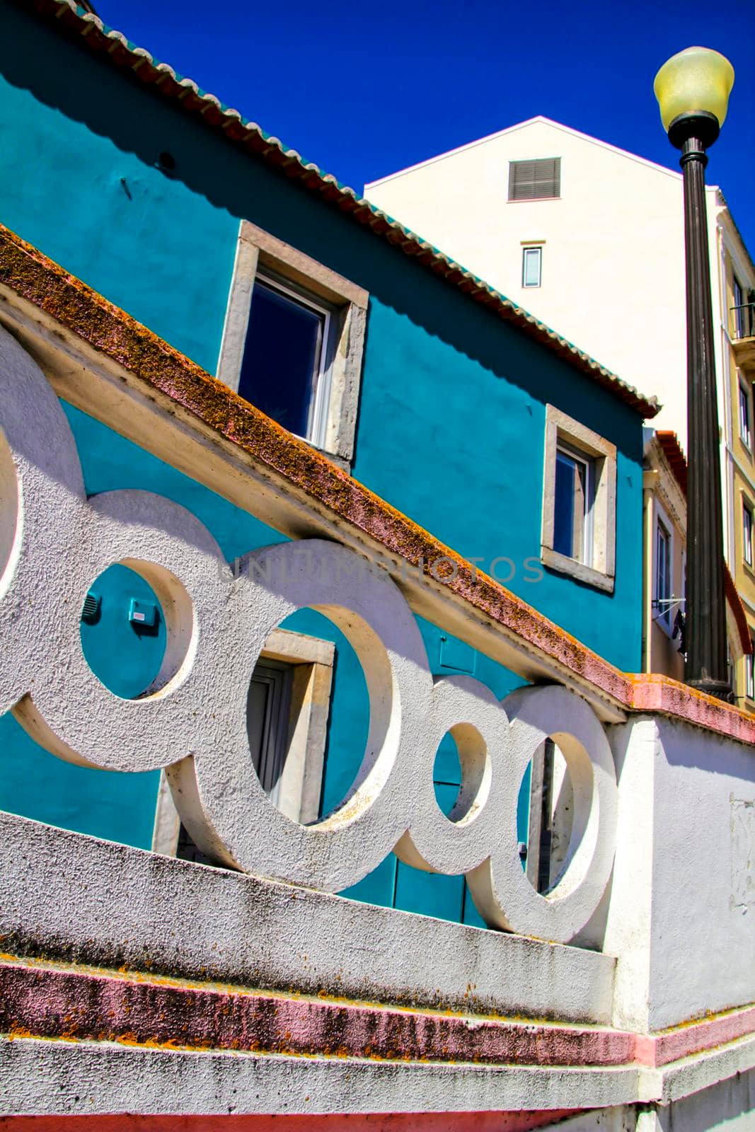 Narrow and colorful streets, majestic facades, windows and balconies of Lisbon, Portugal