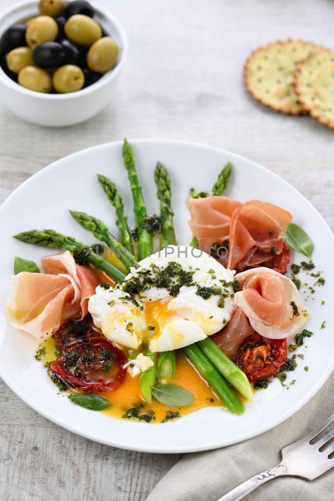 Best Eggs Benedict - Poached eggs with prosciutto, asparagus, sun-dried tomatoes and pesto