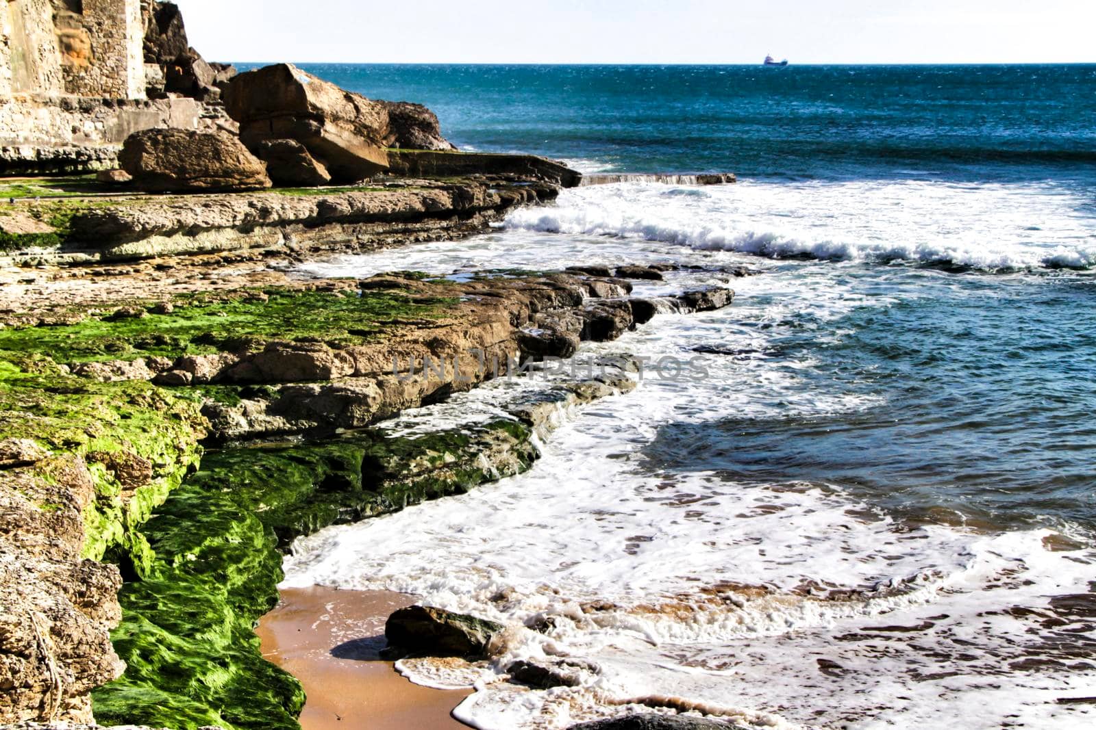 Beautiful Azarujinha beach with rock formations in Estoril, Lisbon, Portugal, in a sunny day of winter