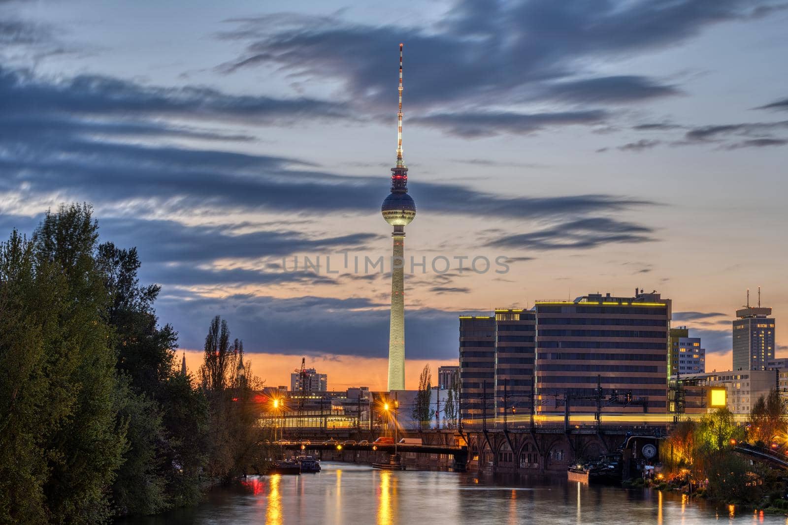 The famous Television Tower and the river Spree in Berlin after sunset