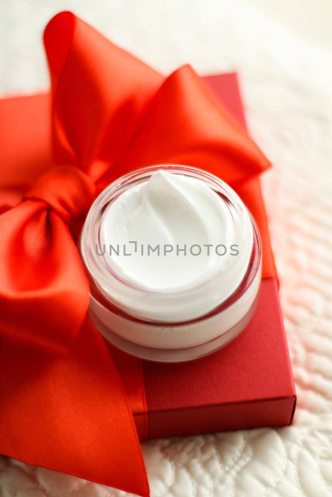 Beauty, cosmetics and skincare styled concept - Luxury face cream jar and red gift box