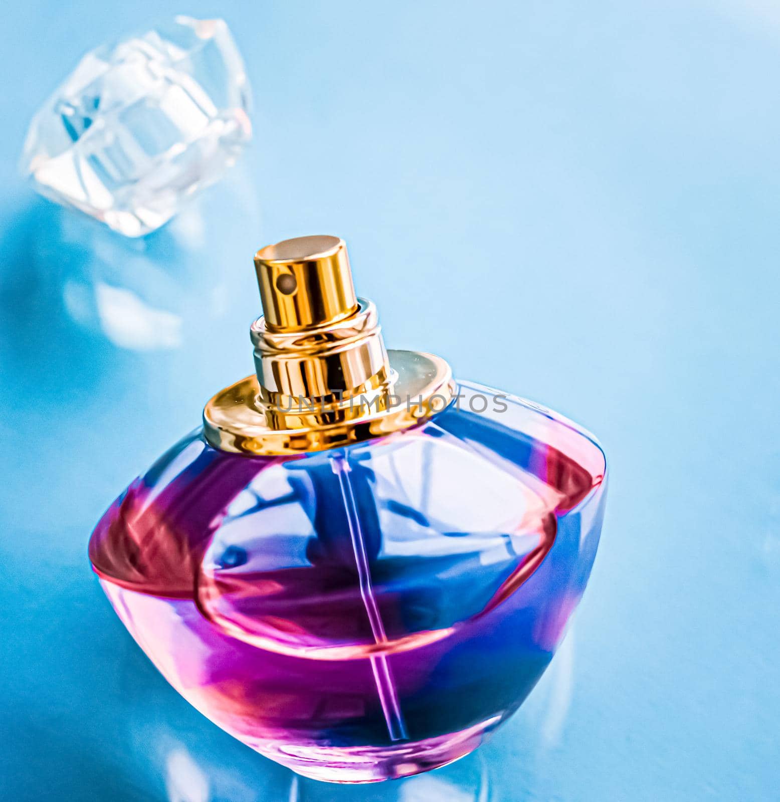 Perfume bottle on glossy background, sweet floral scent, glamour fragrance and eau de parfum as holiday gift and luxury beauty cosmetics brand design.