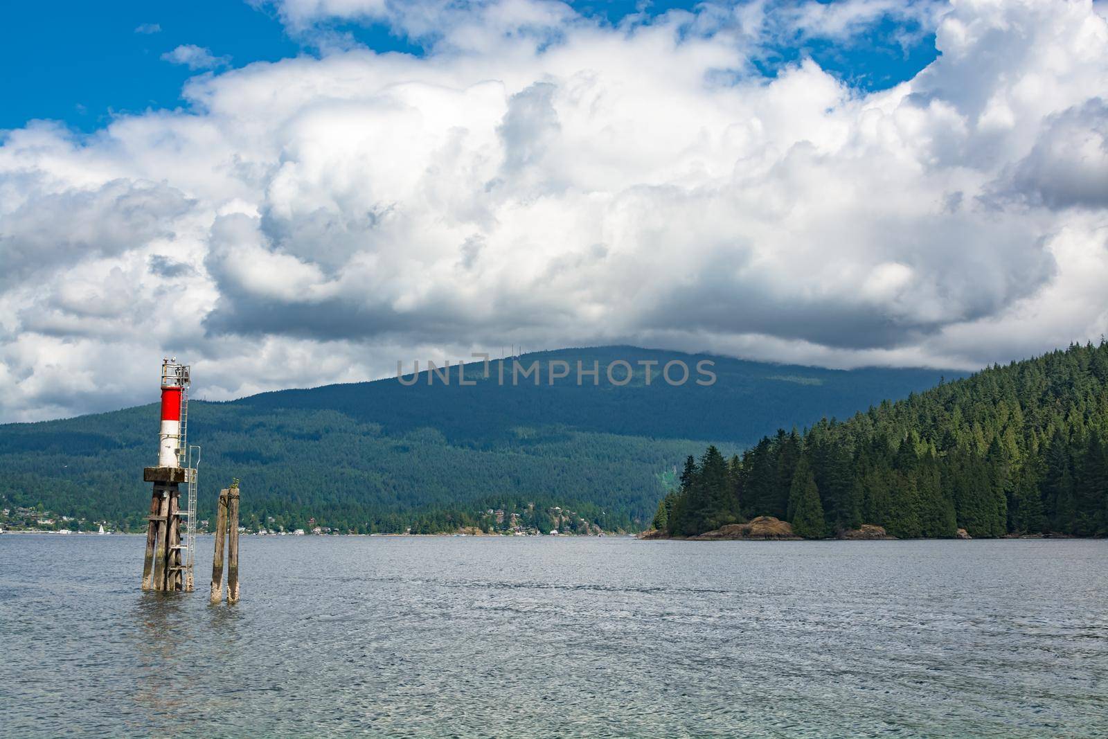 Beautiful view over ocean harbor with ship channel light in Vancouver, Canada. - Image