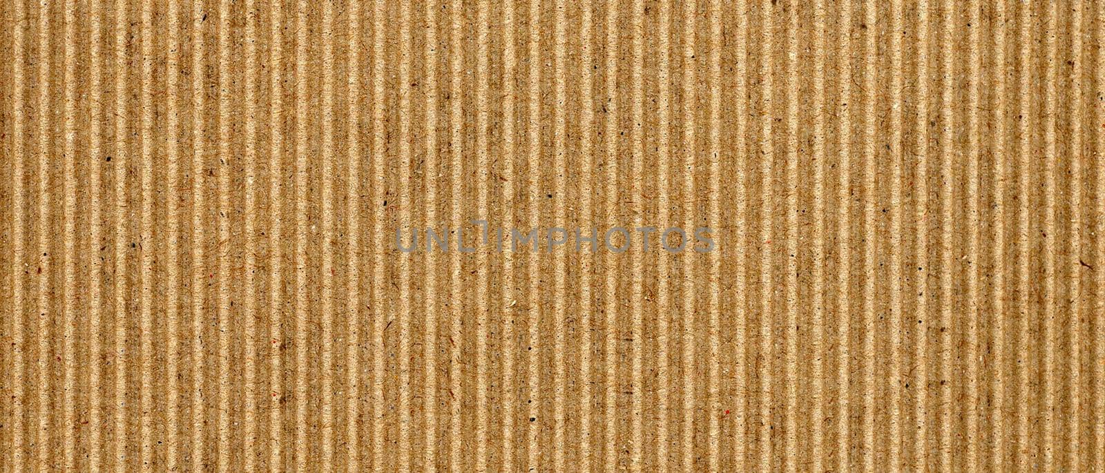 wide brown corrugated cardboard texture background by claudiodivizia