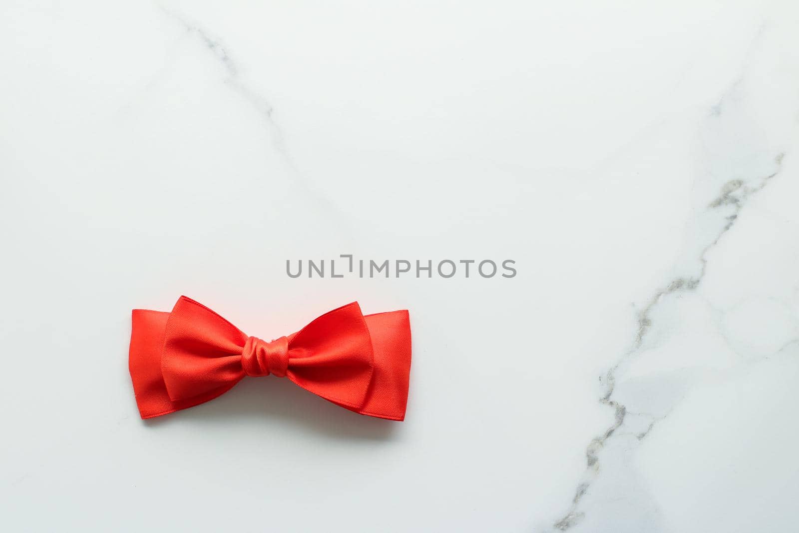 Holiday decor, feminine design and flatlay concept - Red silk ribbon on marble, top view