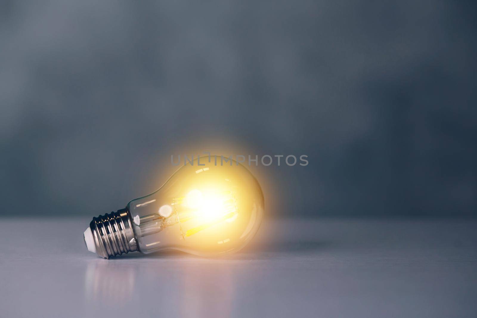 Light bulb with symbol of idea and inspiration, lightbulb with thinking and imagination efficient for success, solution and invention, bright of incandescent, strategy and planning, business concept.