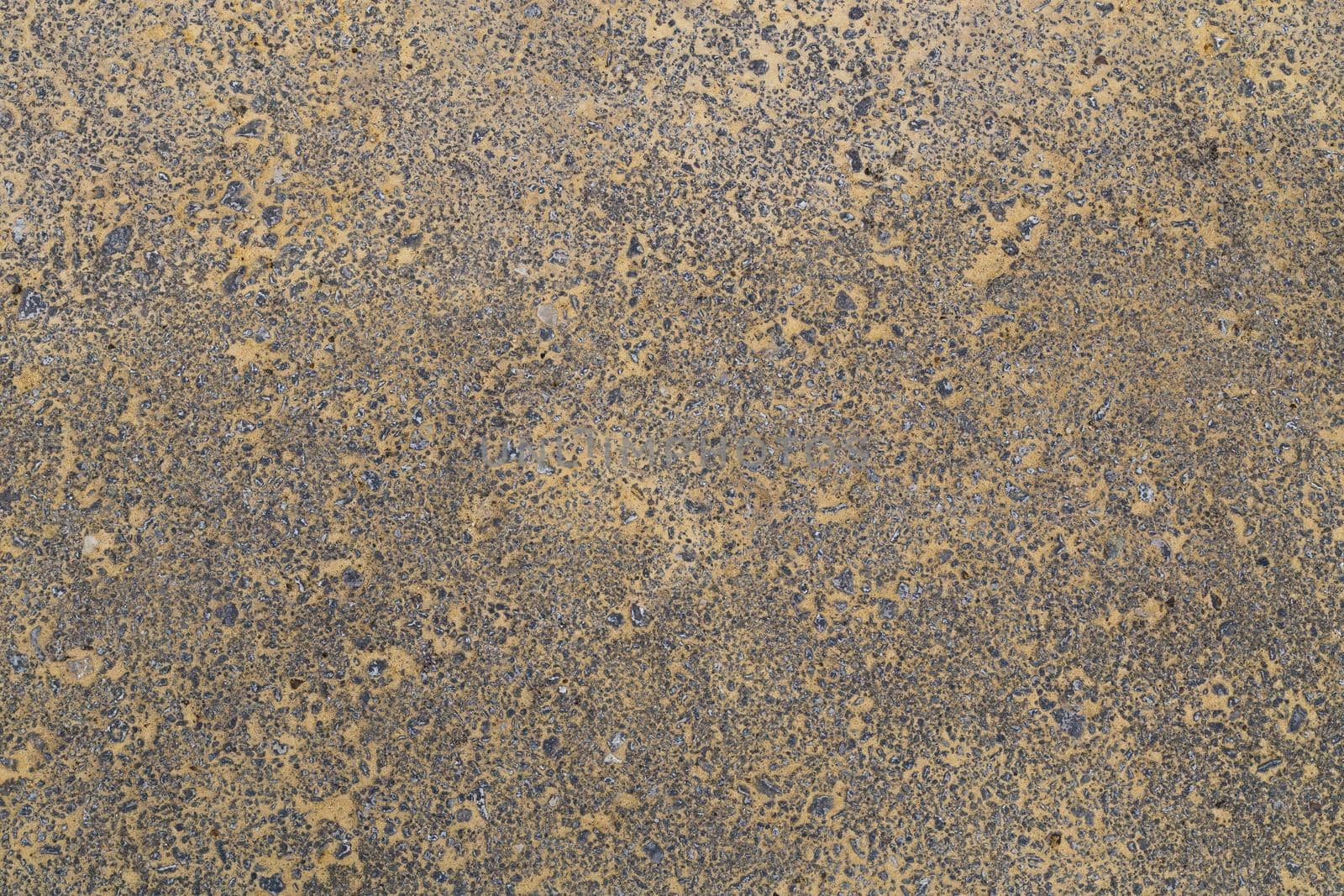 yellow sand covered asphalt texture and background, directly above view