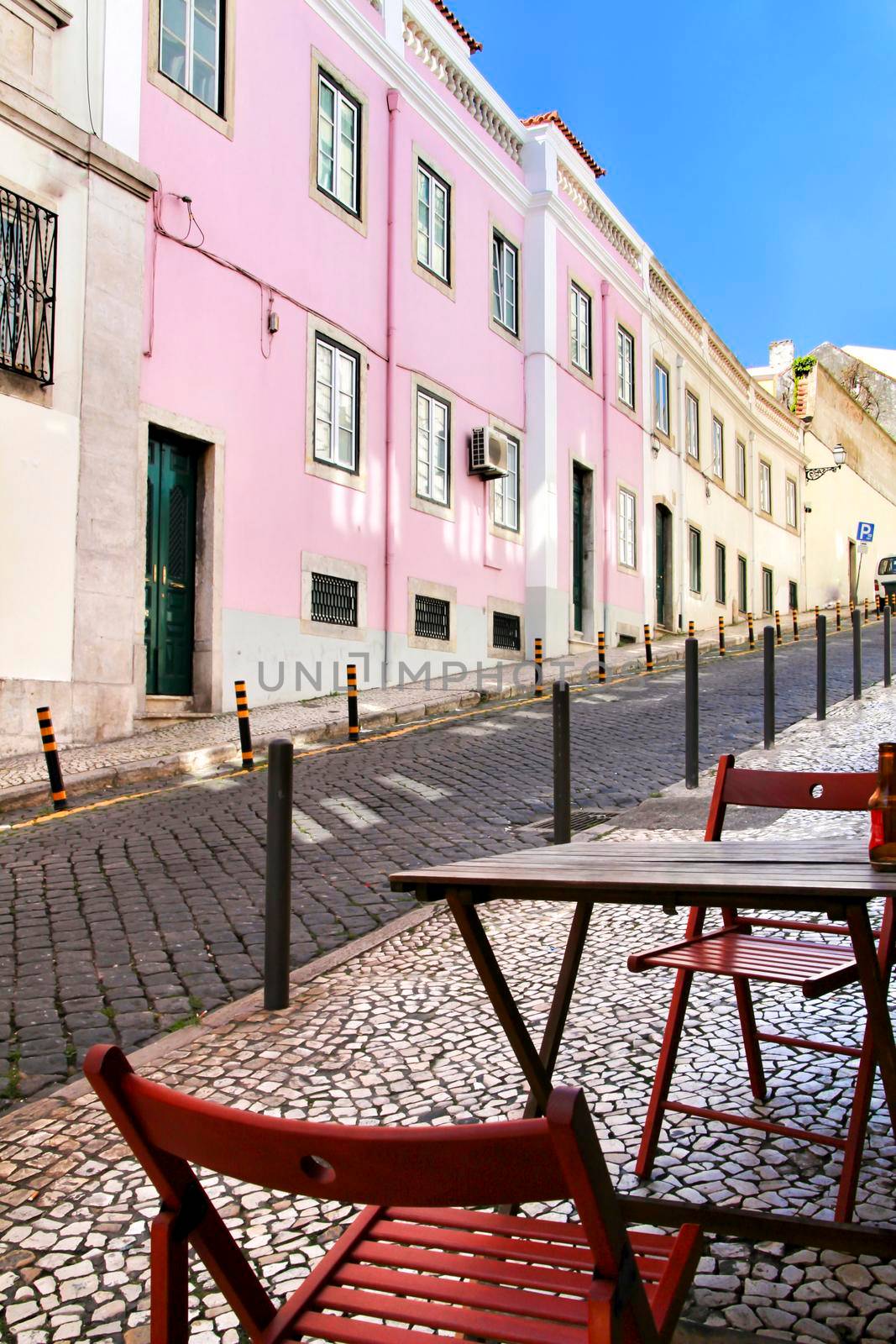 Narrow and colorful streets, majestic facades, windows and balconies of Lisbon, Portugal