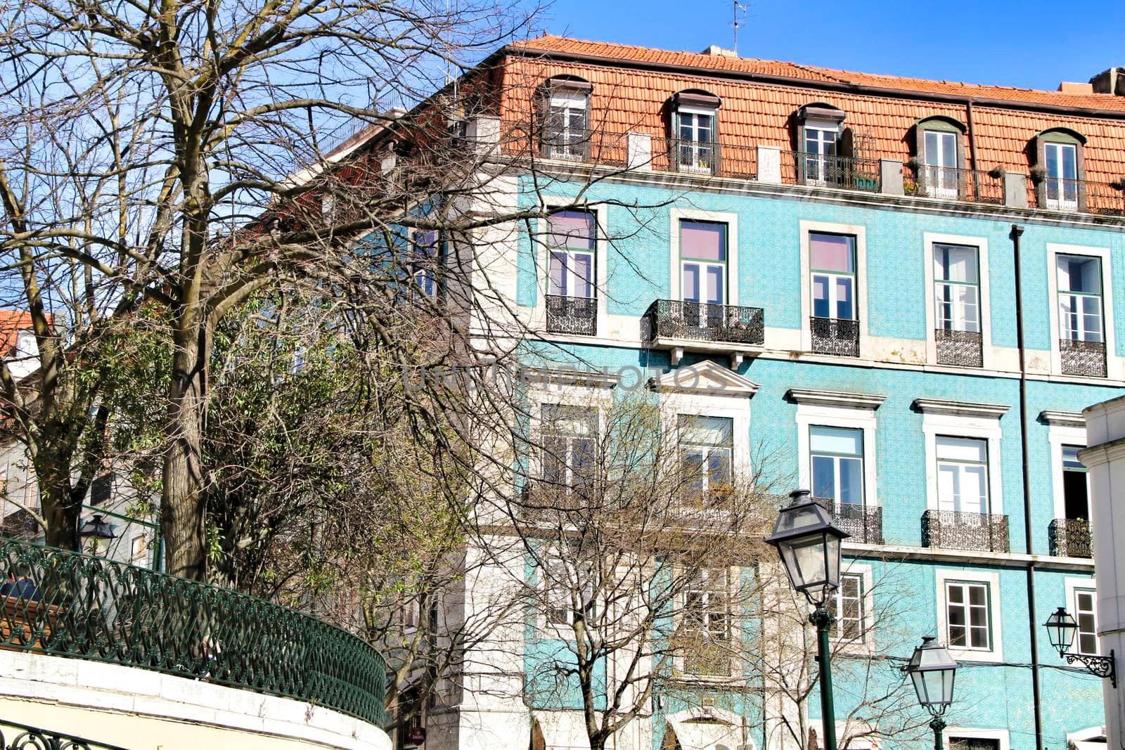 Narrow and colorful streets, majestic facades, windows and balconies of Lisbon, Portugal
