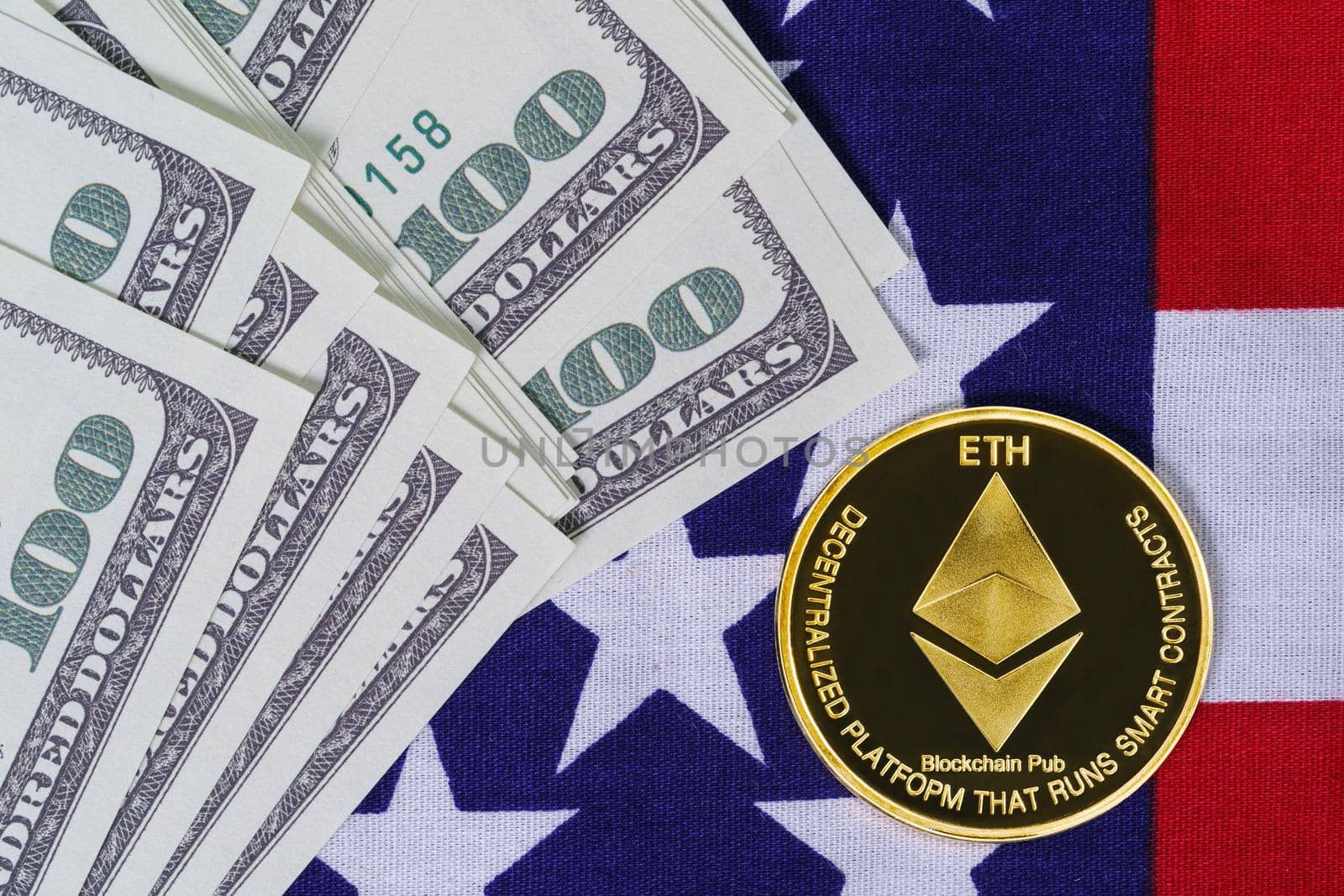 Crypto currency concept. Gold Ethereum coin and banknote on flag of United States of America USA