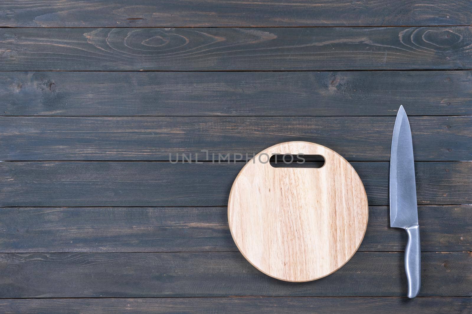 kitchen knife and wooden round empty cutting board  by stoonn