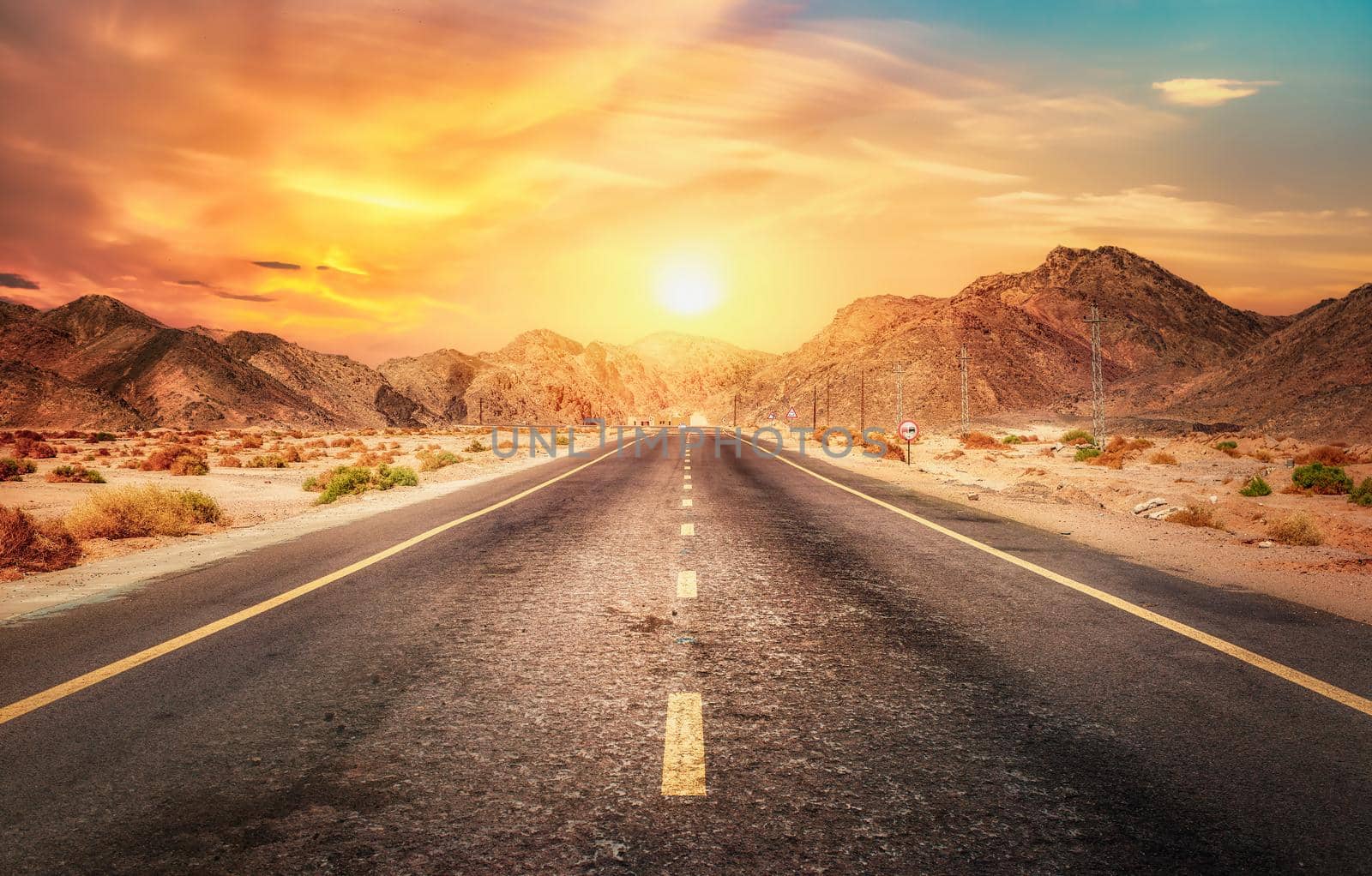 Morning sun over road in desert of Egypt