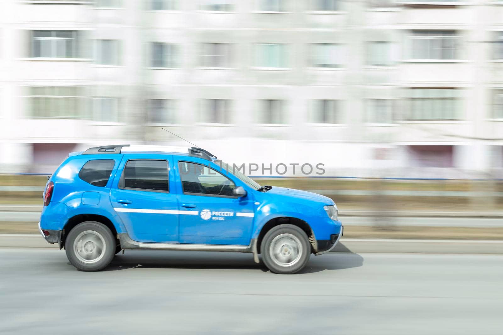 Blue cars in motion. Surgut, Russia - 16 April 2021 by Essffes
